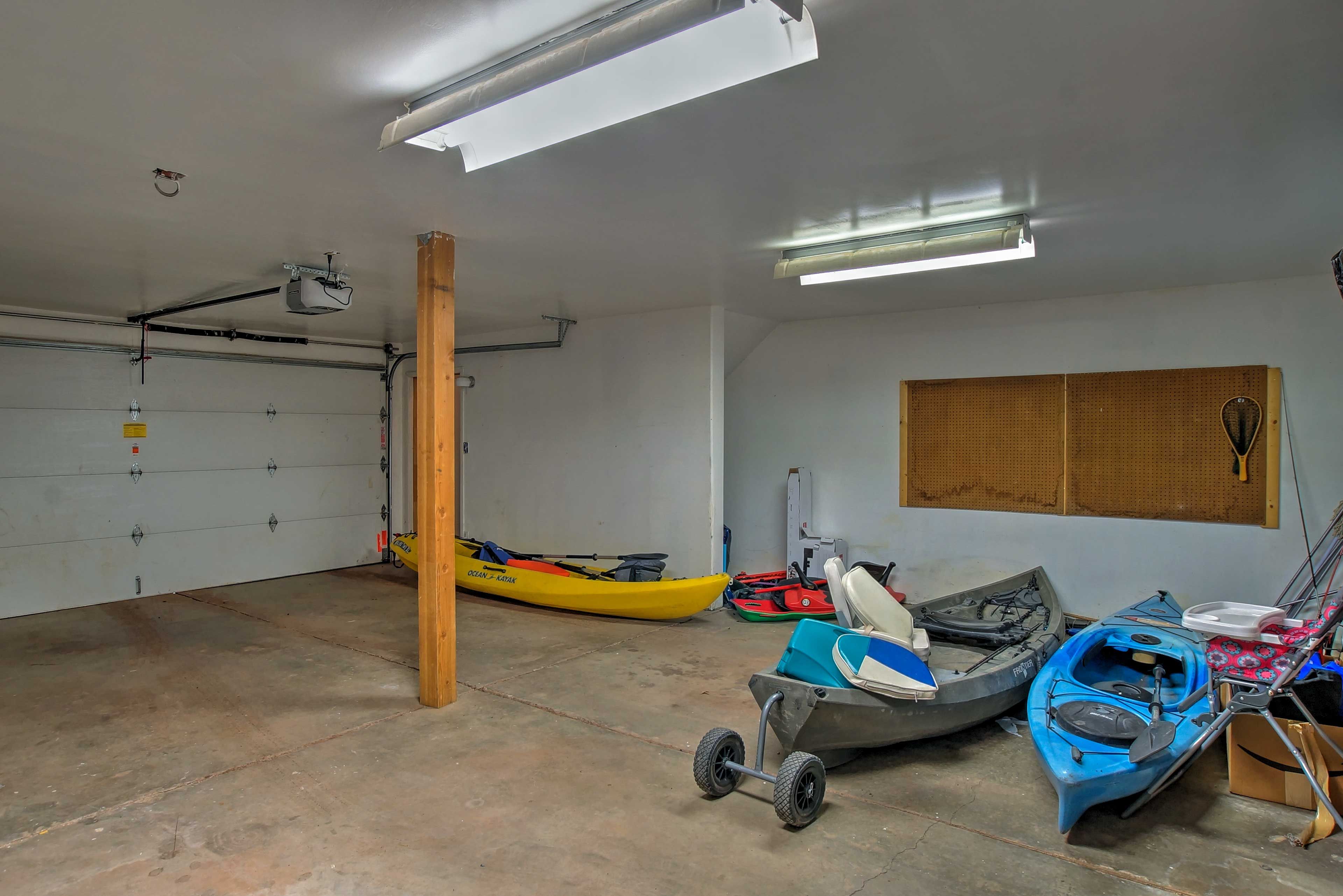 Find kayaks and a paddle boat for your use in the 2-car garage.
