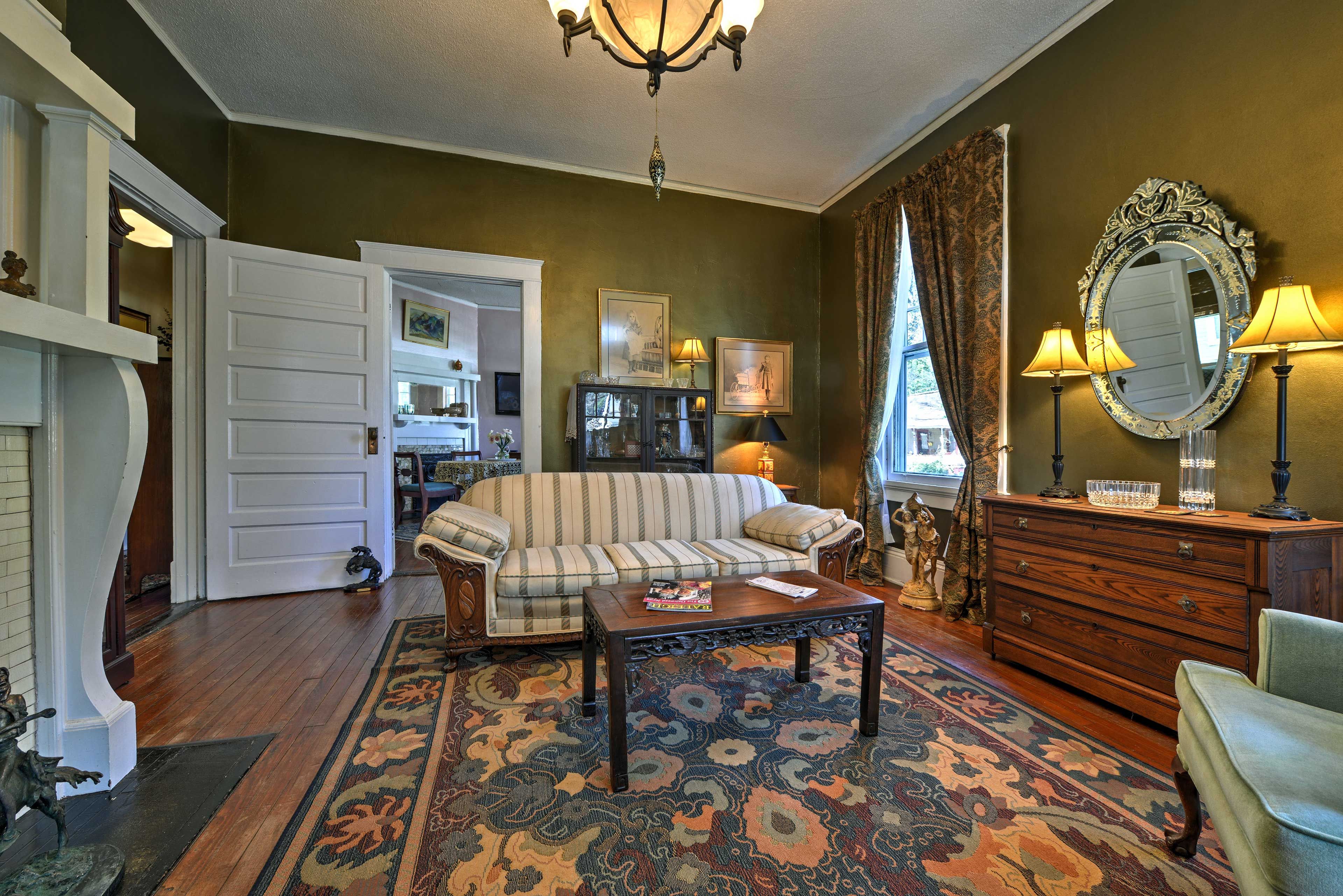 High ceilings and wood floors fill the living space.