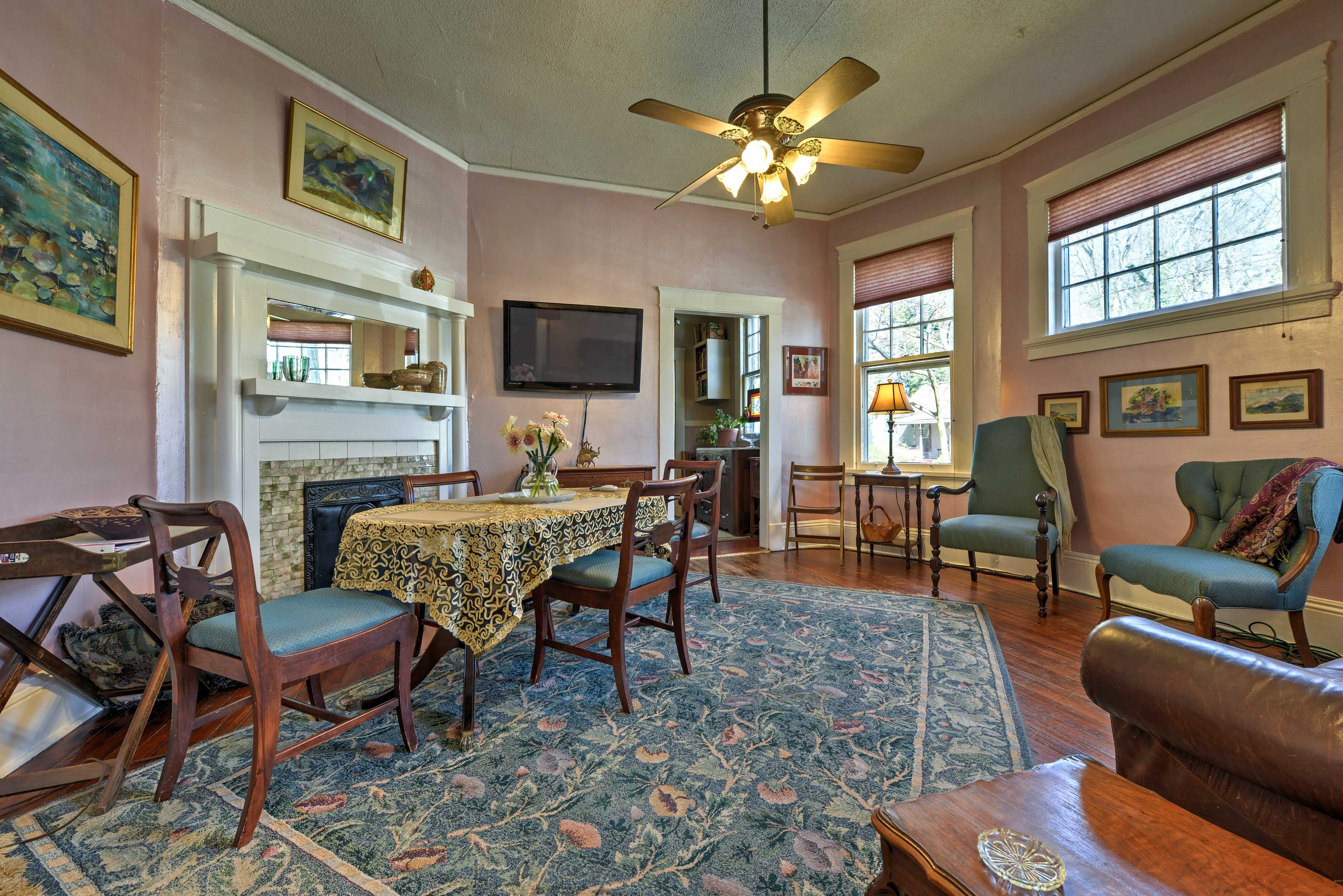 The spacious dining area includes a sofa and flat-screen cable TV.