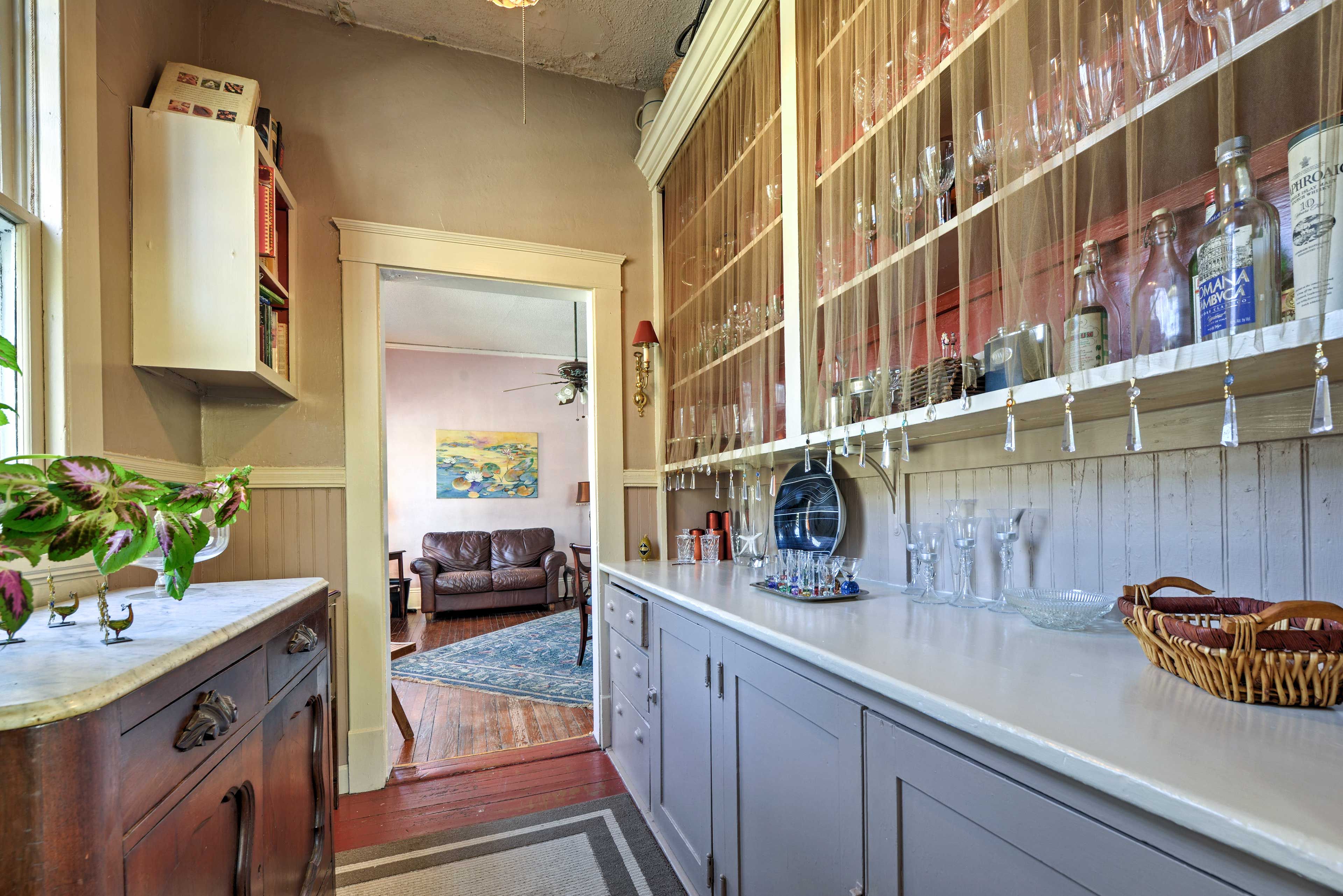 The bar area is stocked with glassware.