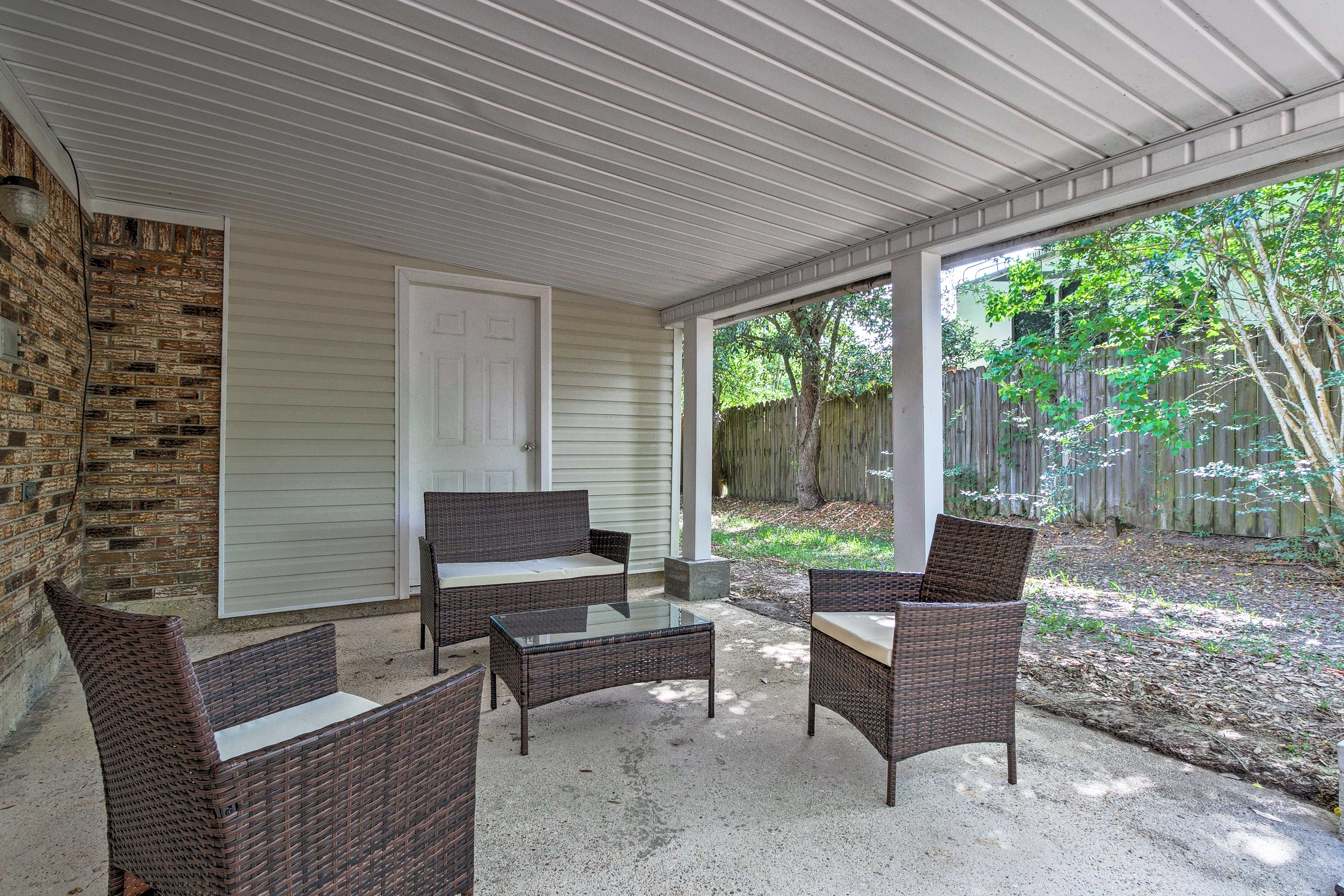 After a day on the coast, retreat to the shaded patio with outdoor furniture.