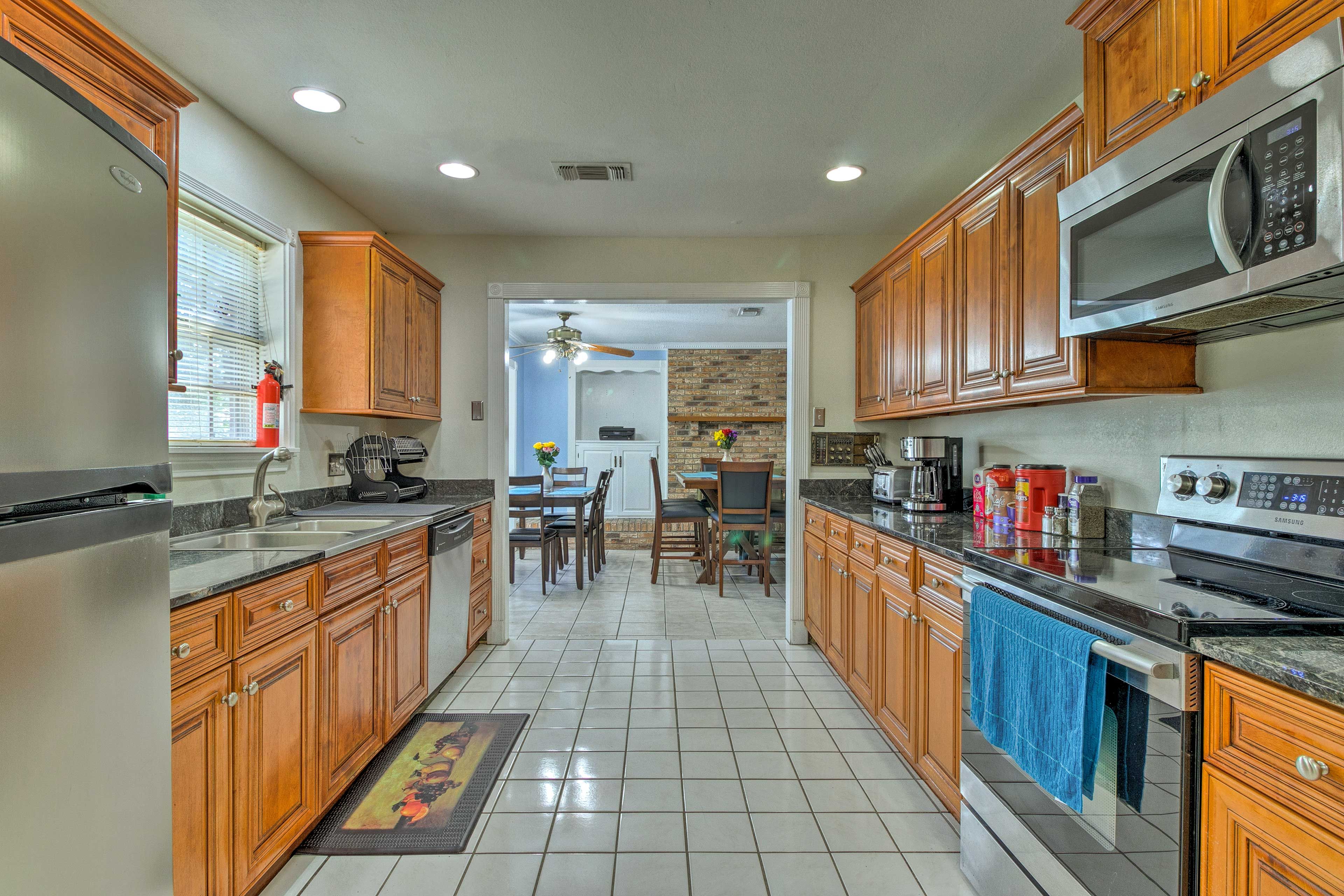 Just through the open doorway, you'll find the fully equipped kitchen.