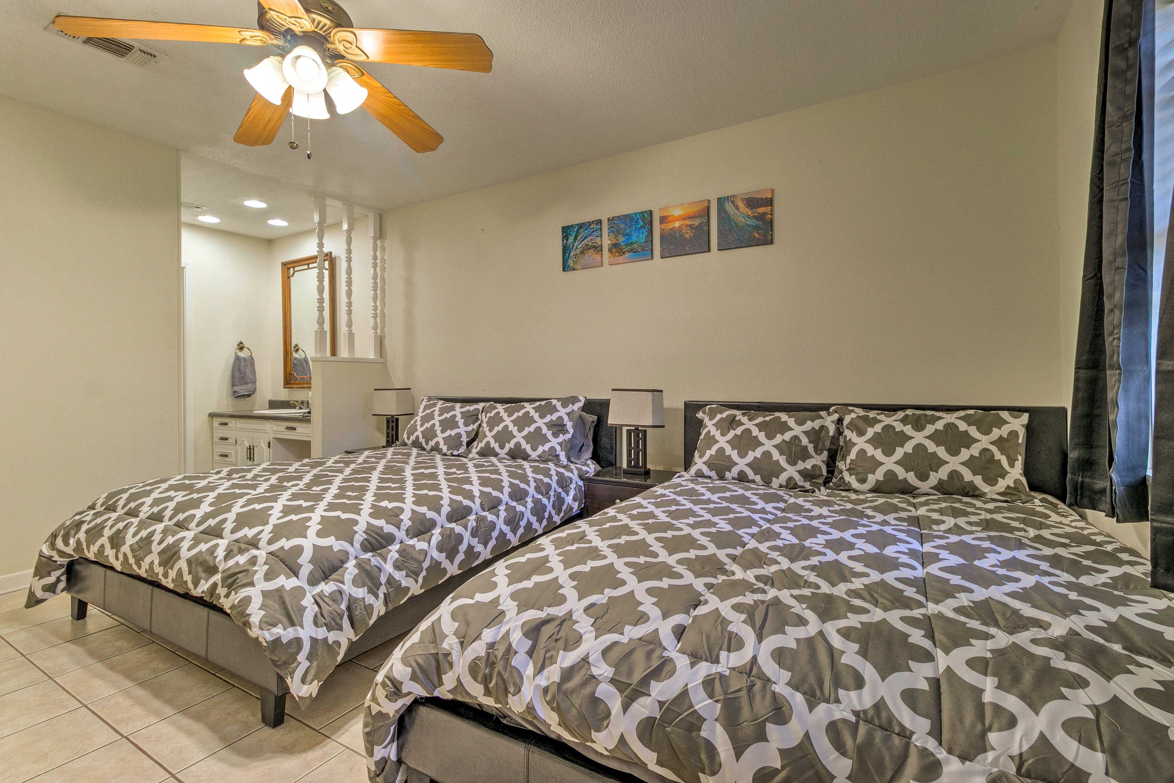 This bedroom features 2 queen beds and an en-suite bathroom.