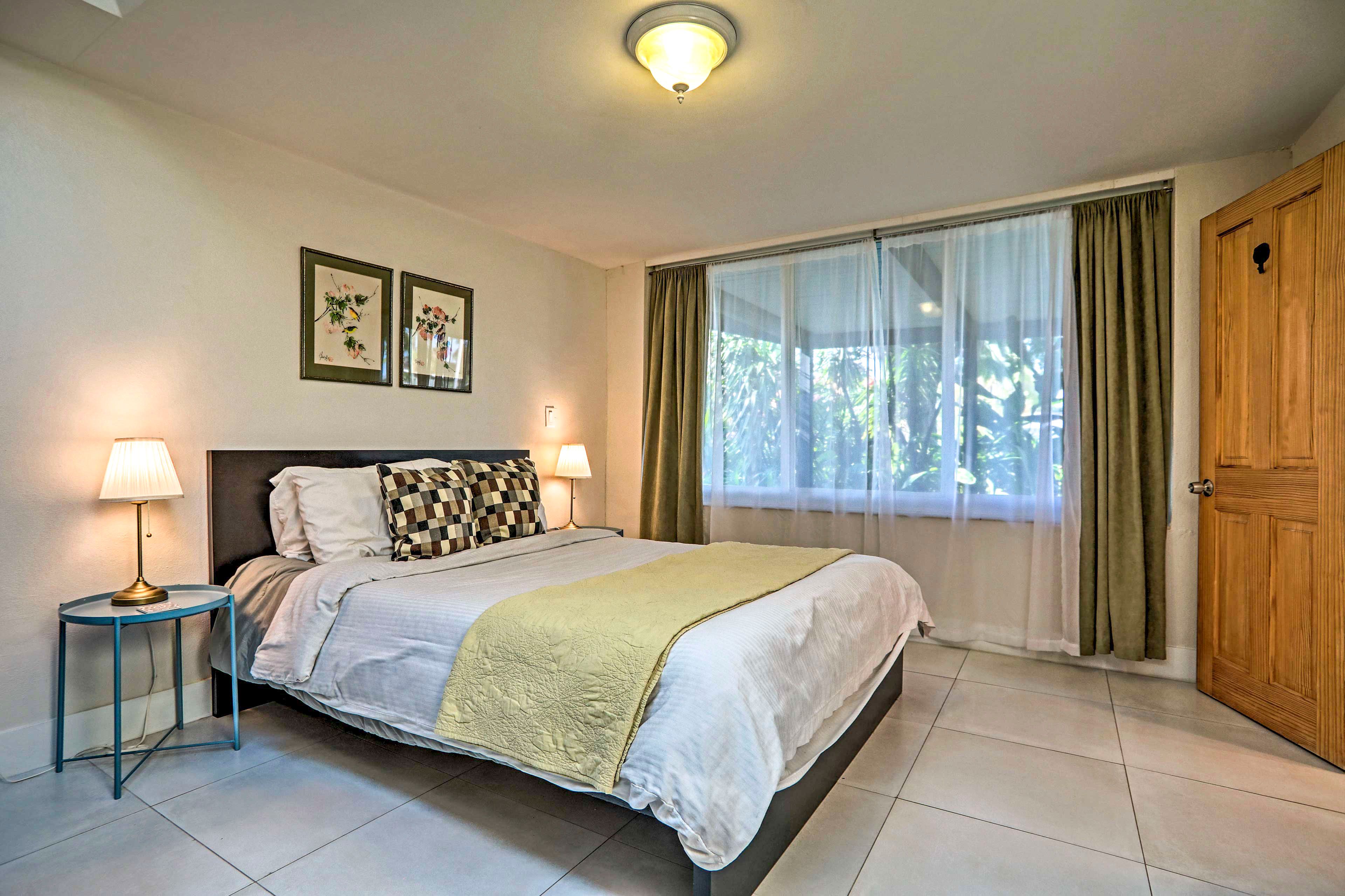 This bedroom boasts a king-sized bed.