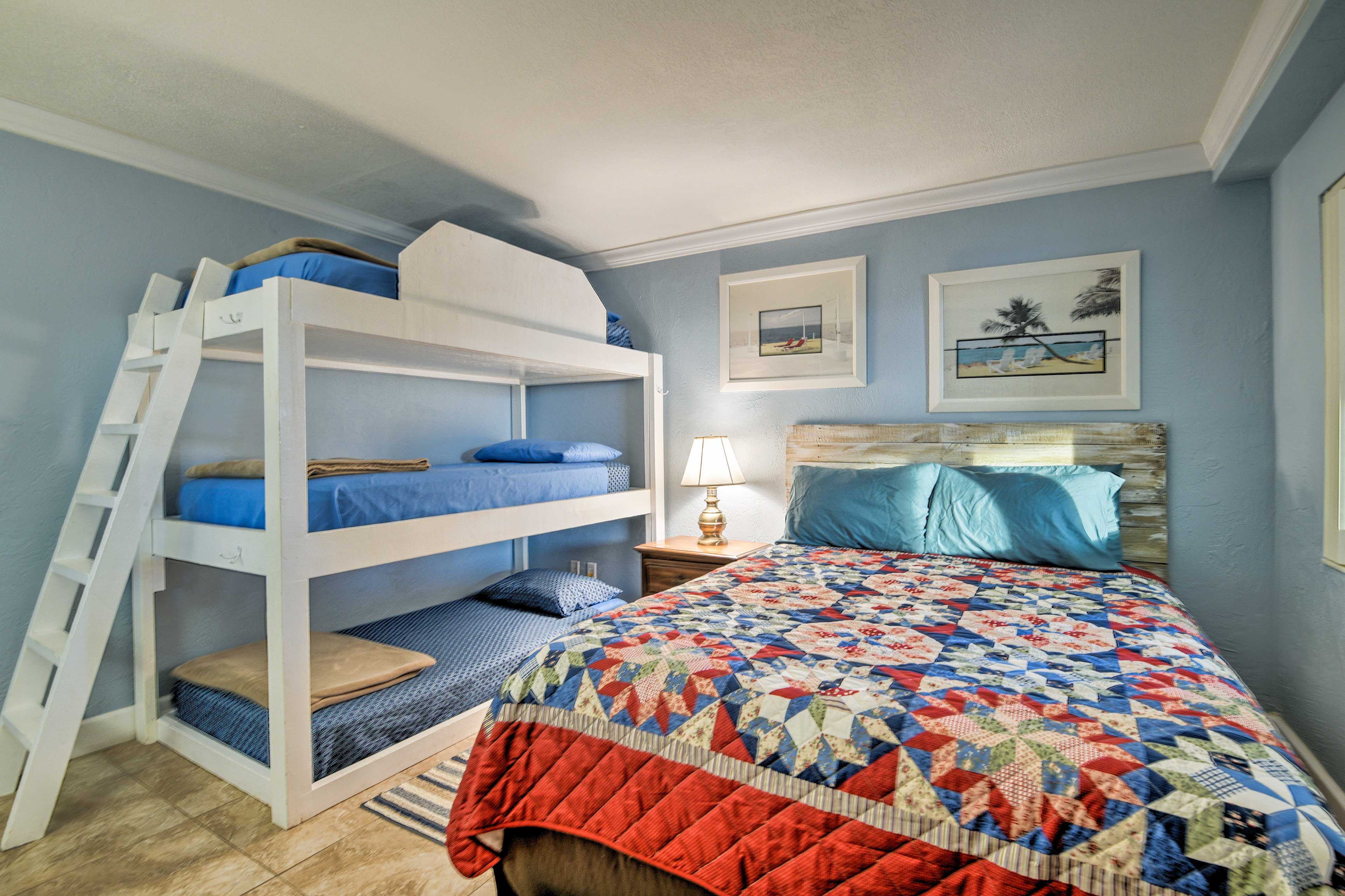 Sleep soundly in the queen-sized bed or 3-tiered bunk bed.