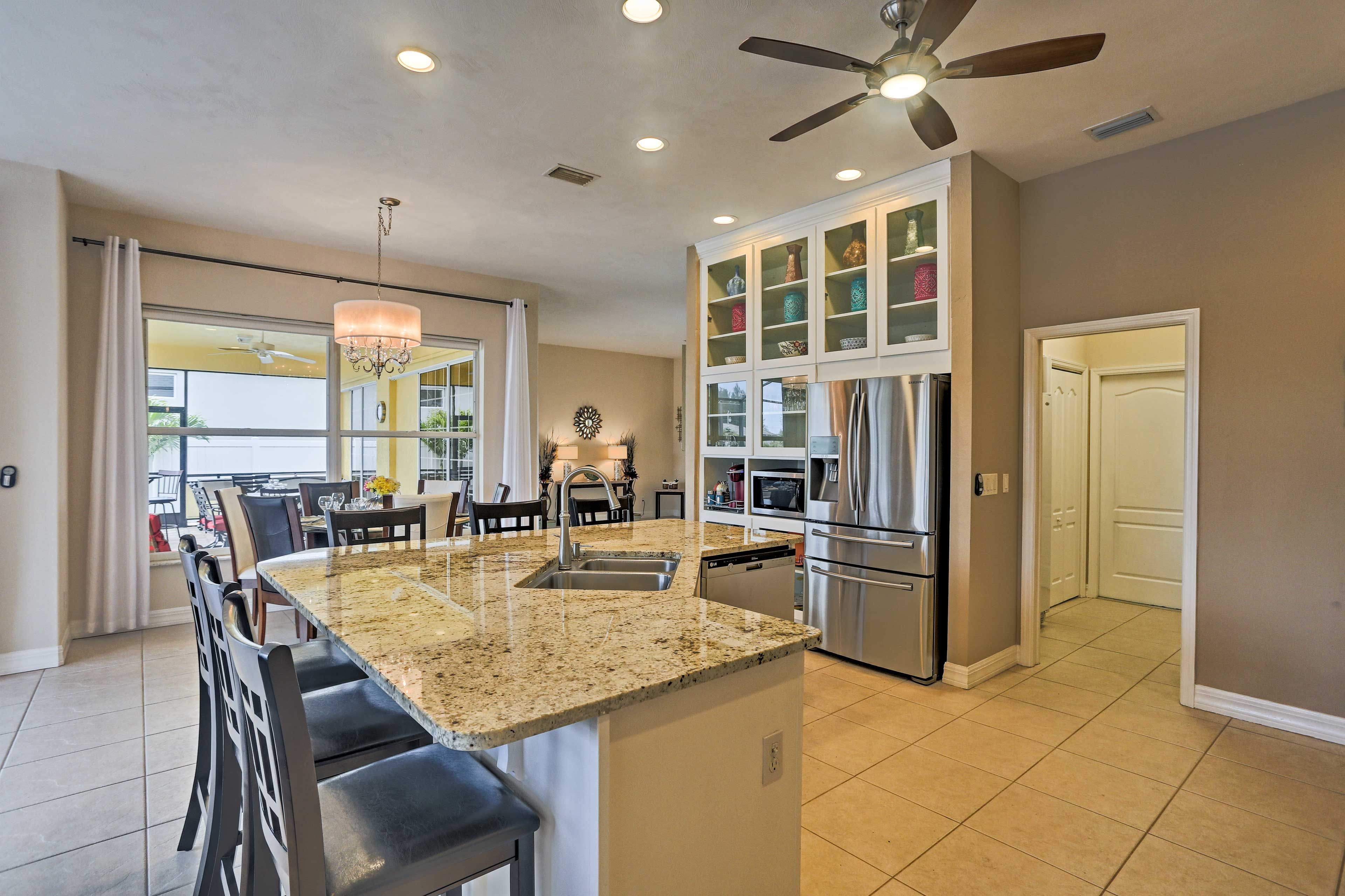 The stainless steel appliances complement the granite countertops.