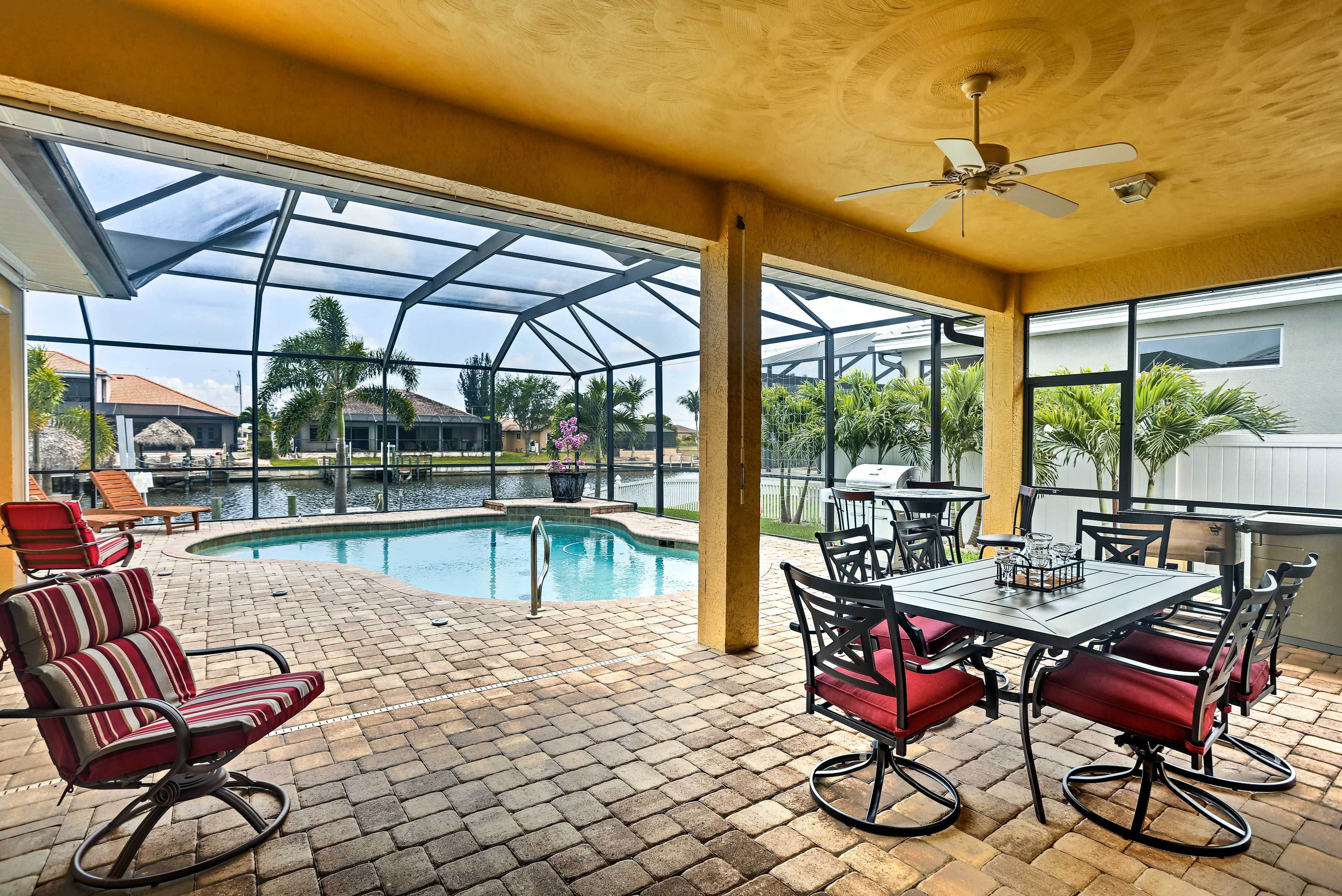 The screened-in lanai is the perfect place to unwind with a cool beverage.