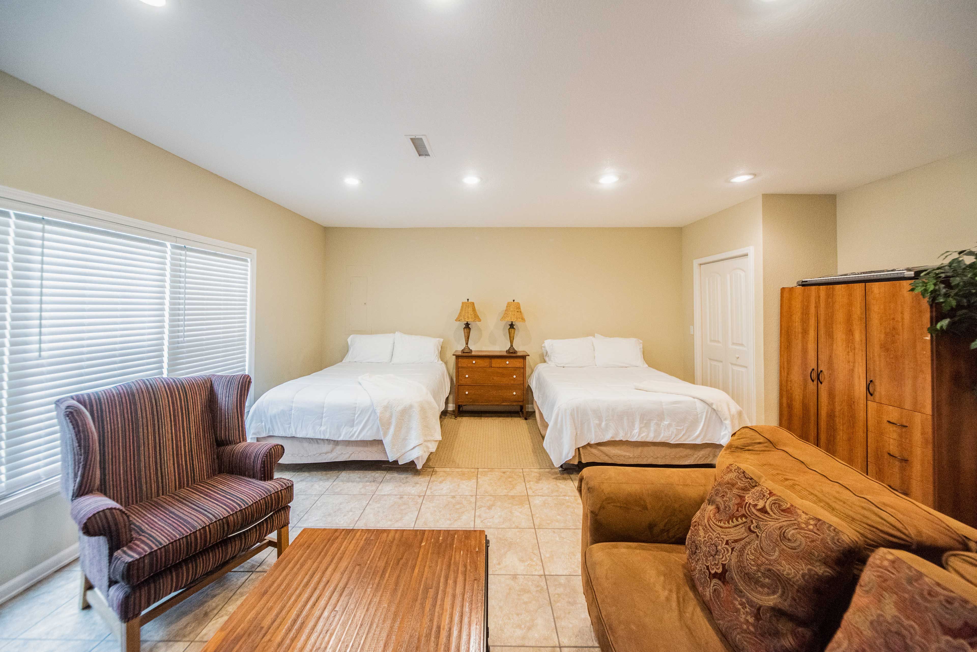 The fourth bedroom features 2 queen beds.