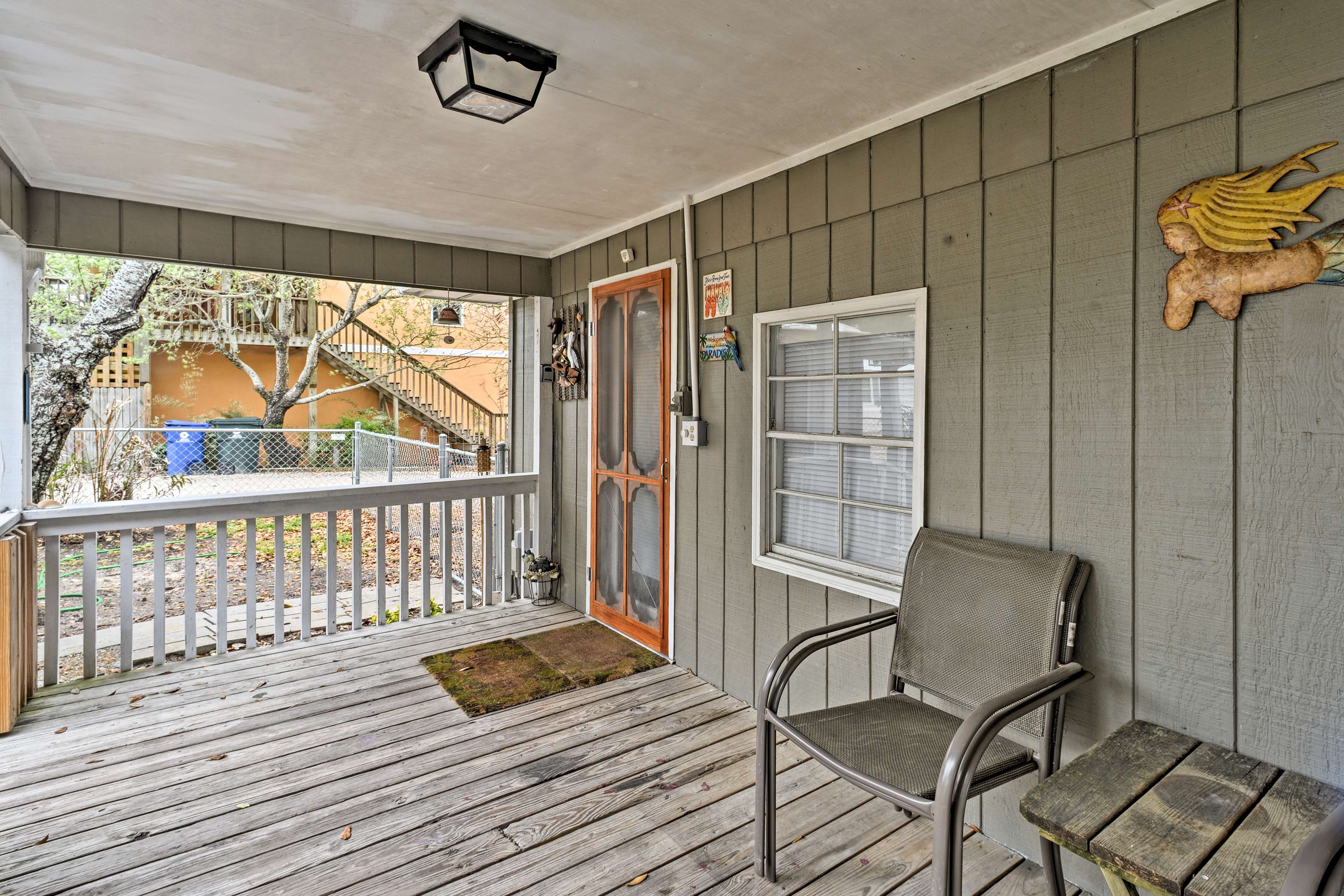 Unwind on the furnished front porch with a refreshing beverage.