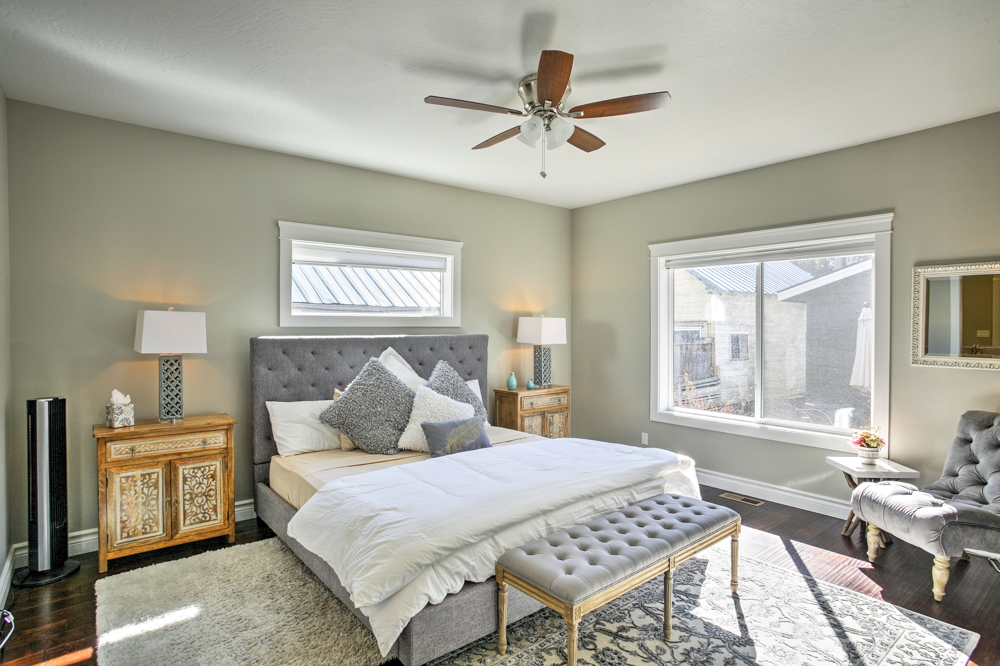 Rest easy in the elegantly furnished bedroom with a king-sized bed.