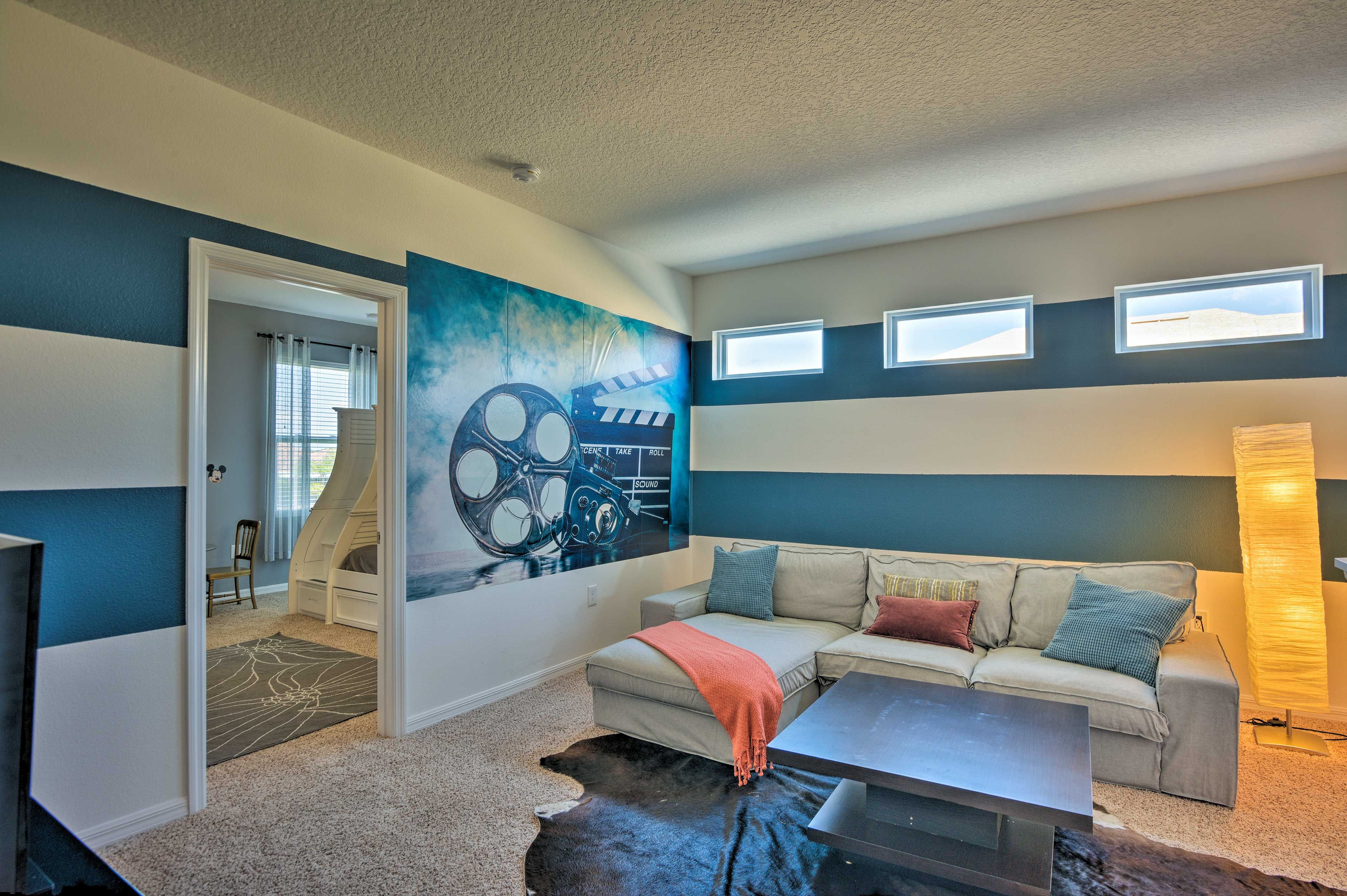 The movie room offers comfortable seating for everyone in your group.