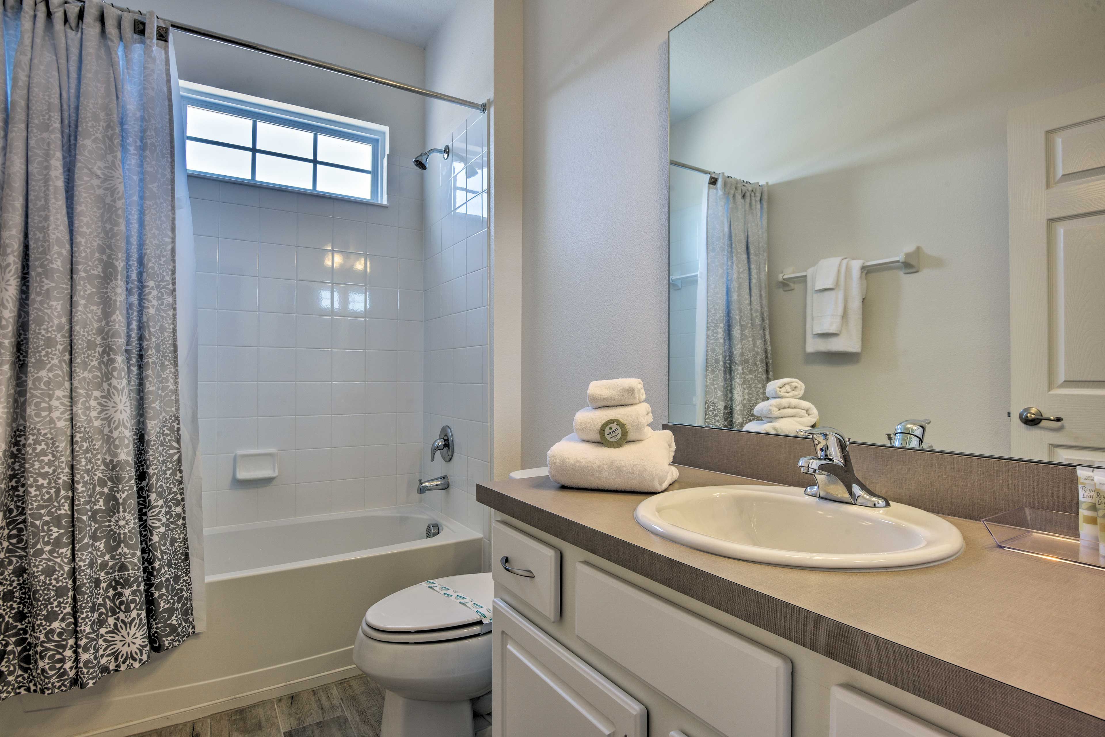 This bathroom has a shower/tub combo.