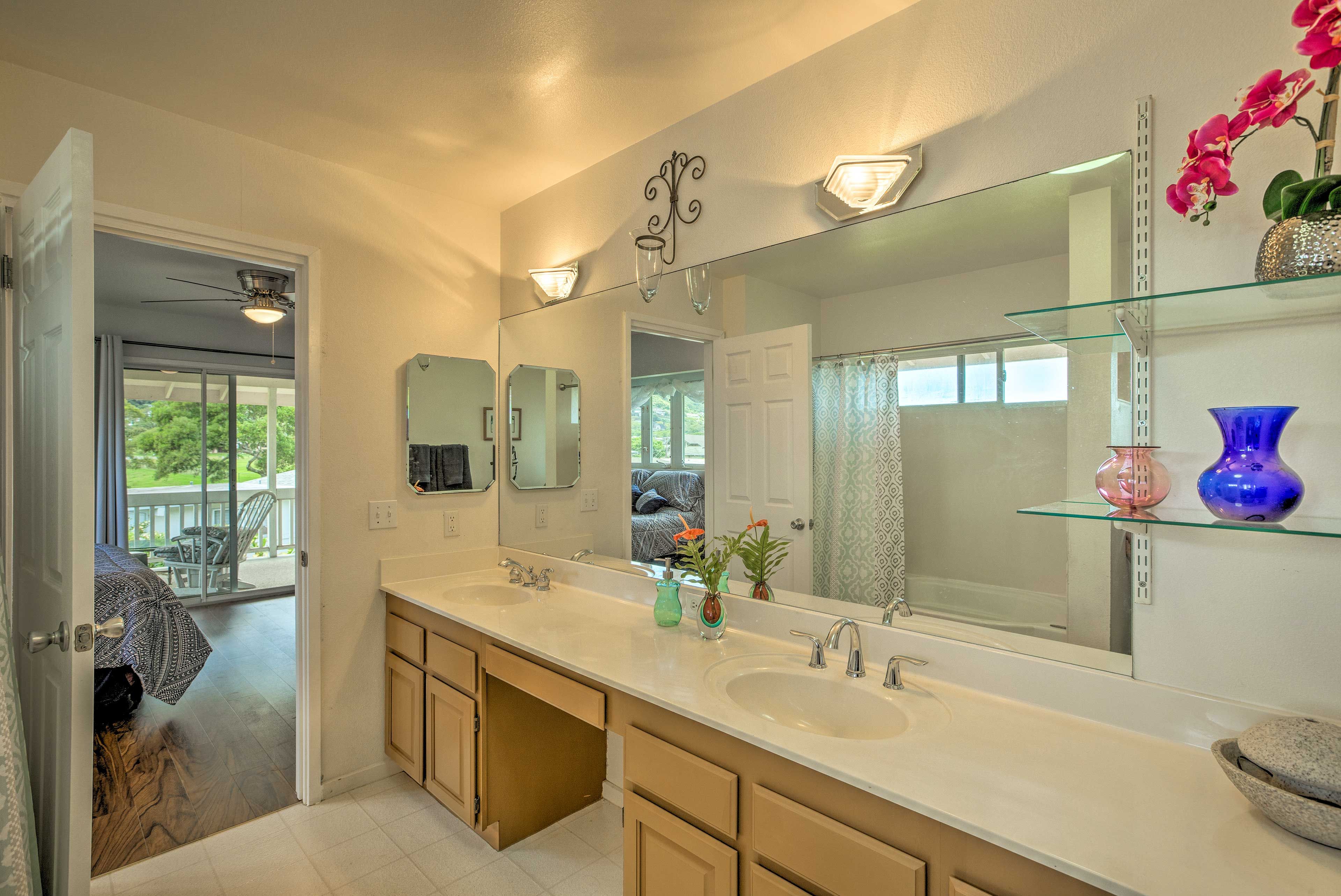 Rinse off in the en-suite bathroom with double vanities.