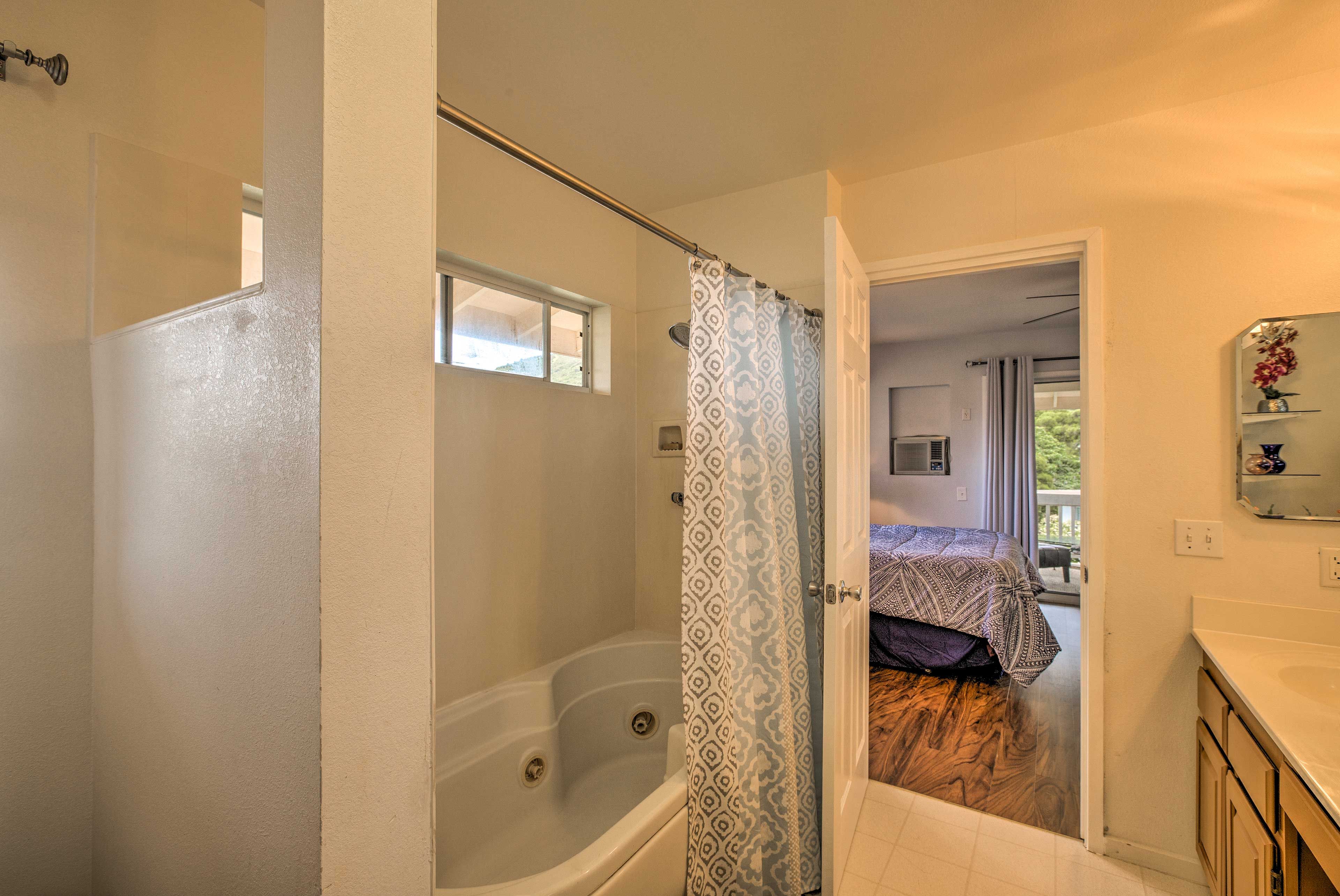 The en-suite bathroom features a shower/tub combo.