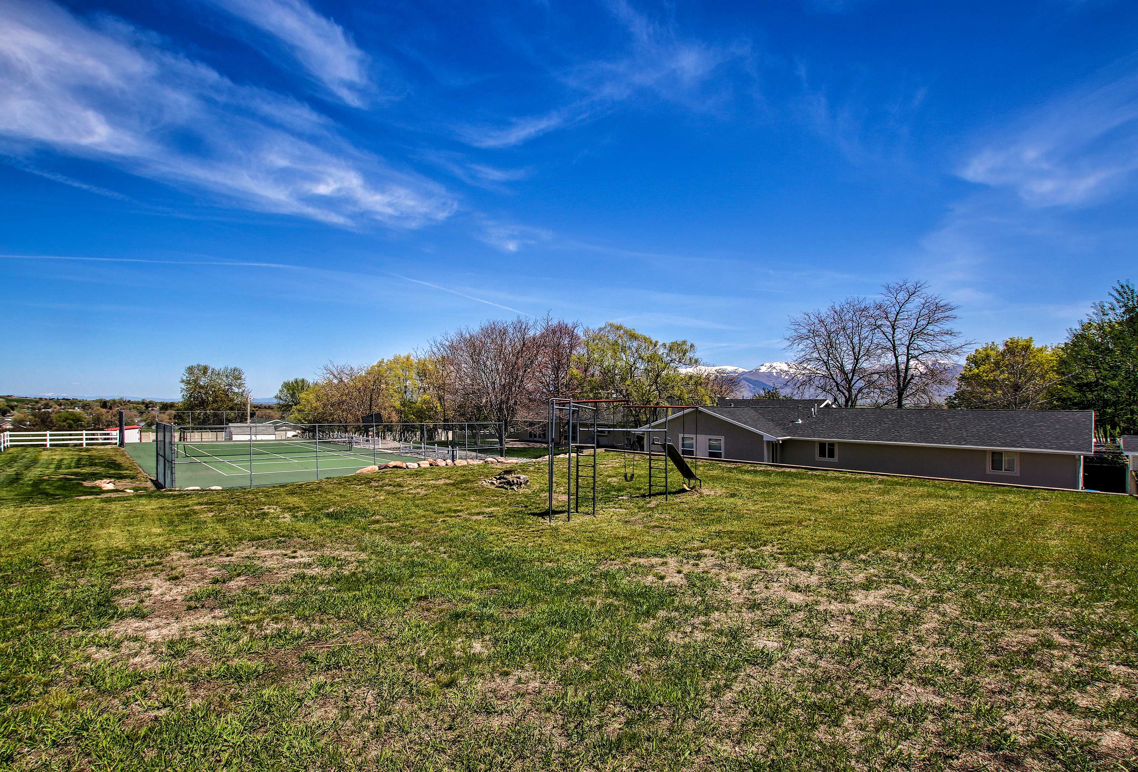 Have some fun on the playground in the backyard.