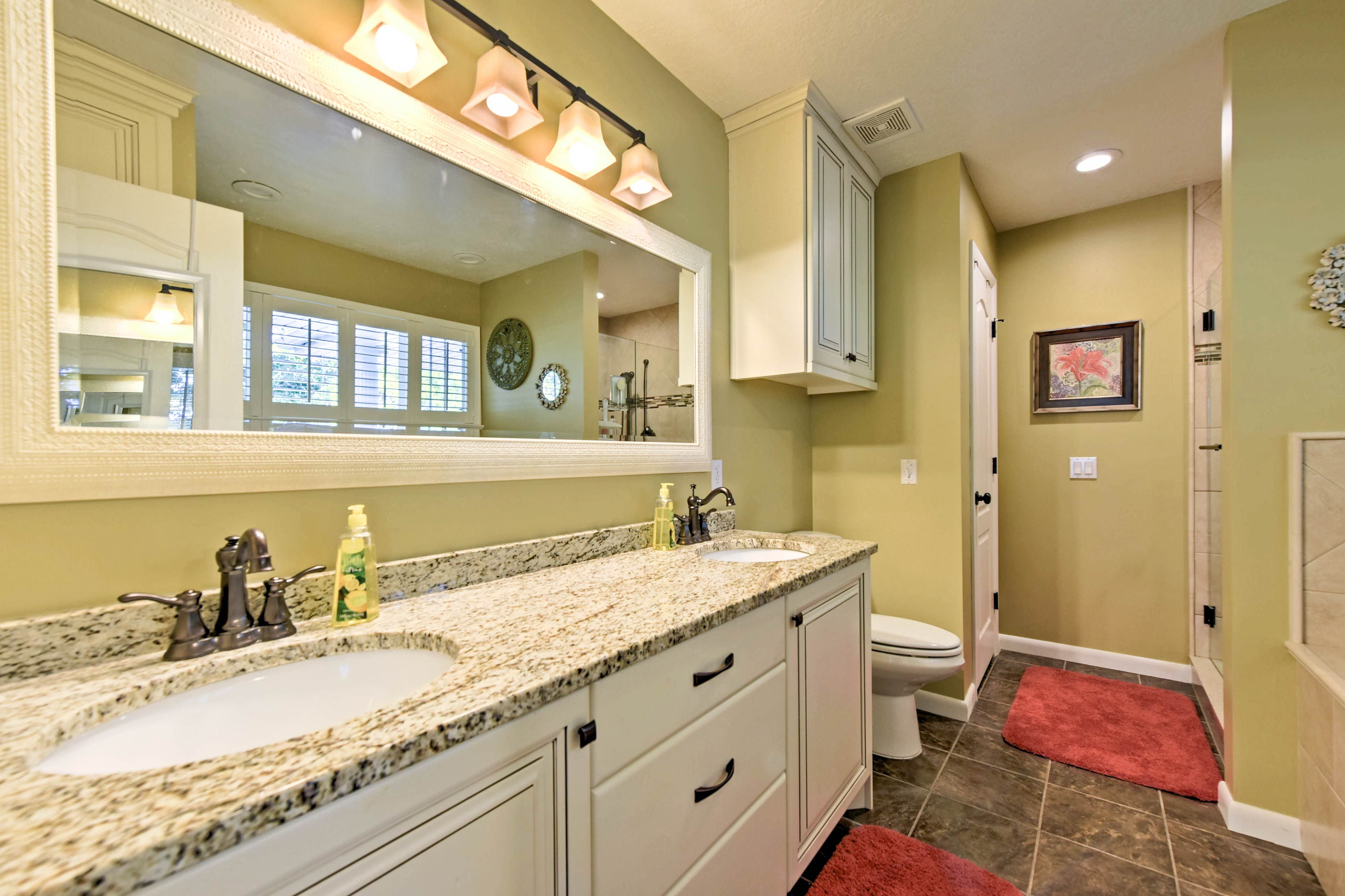The en-suite bathroom hosts double sinks and a separate tub and shower.
