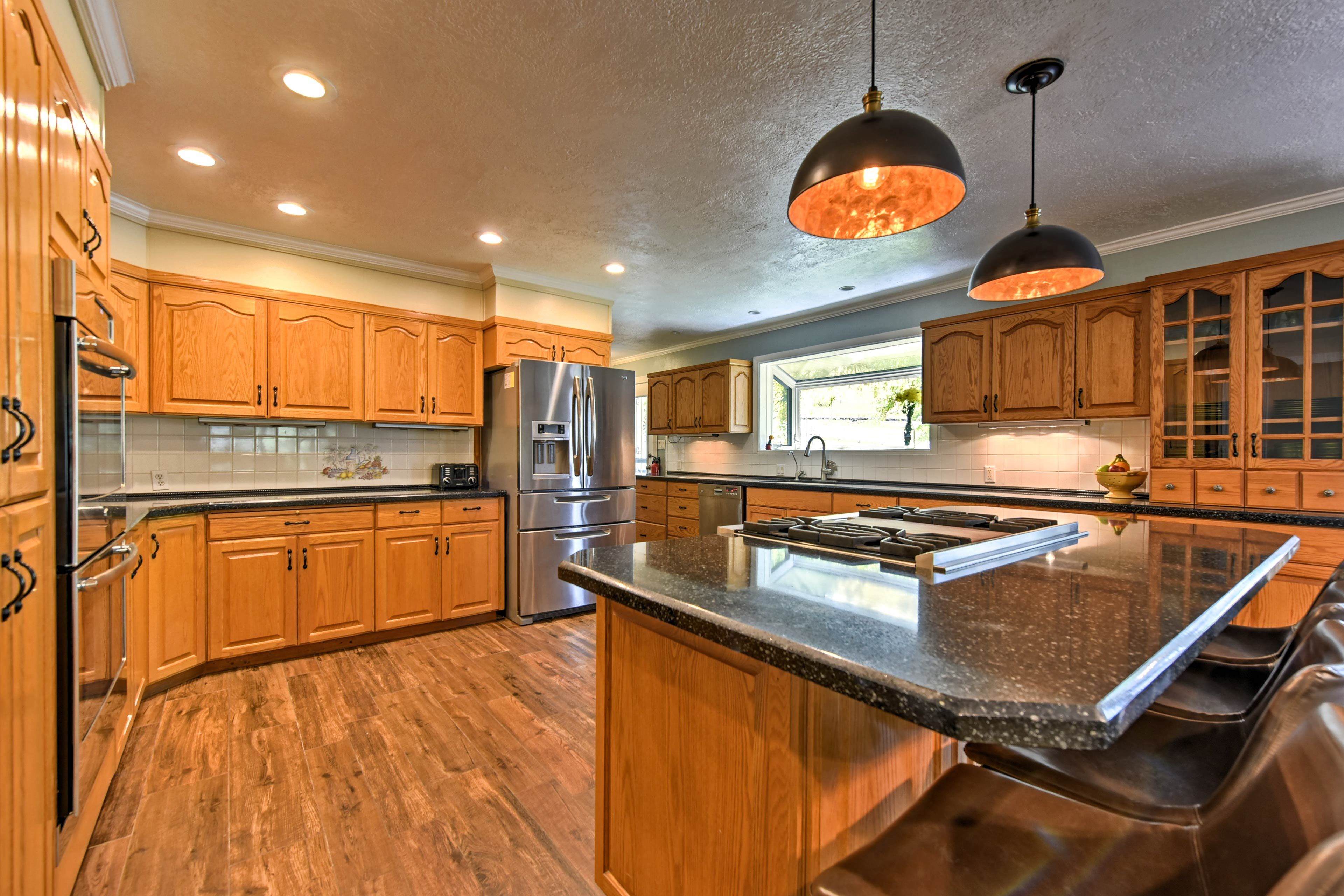 Stainless steel appliances furnish the fully equipped kitchen.