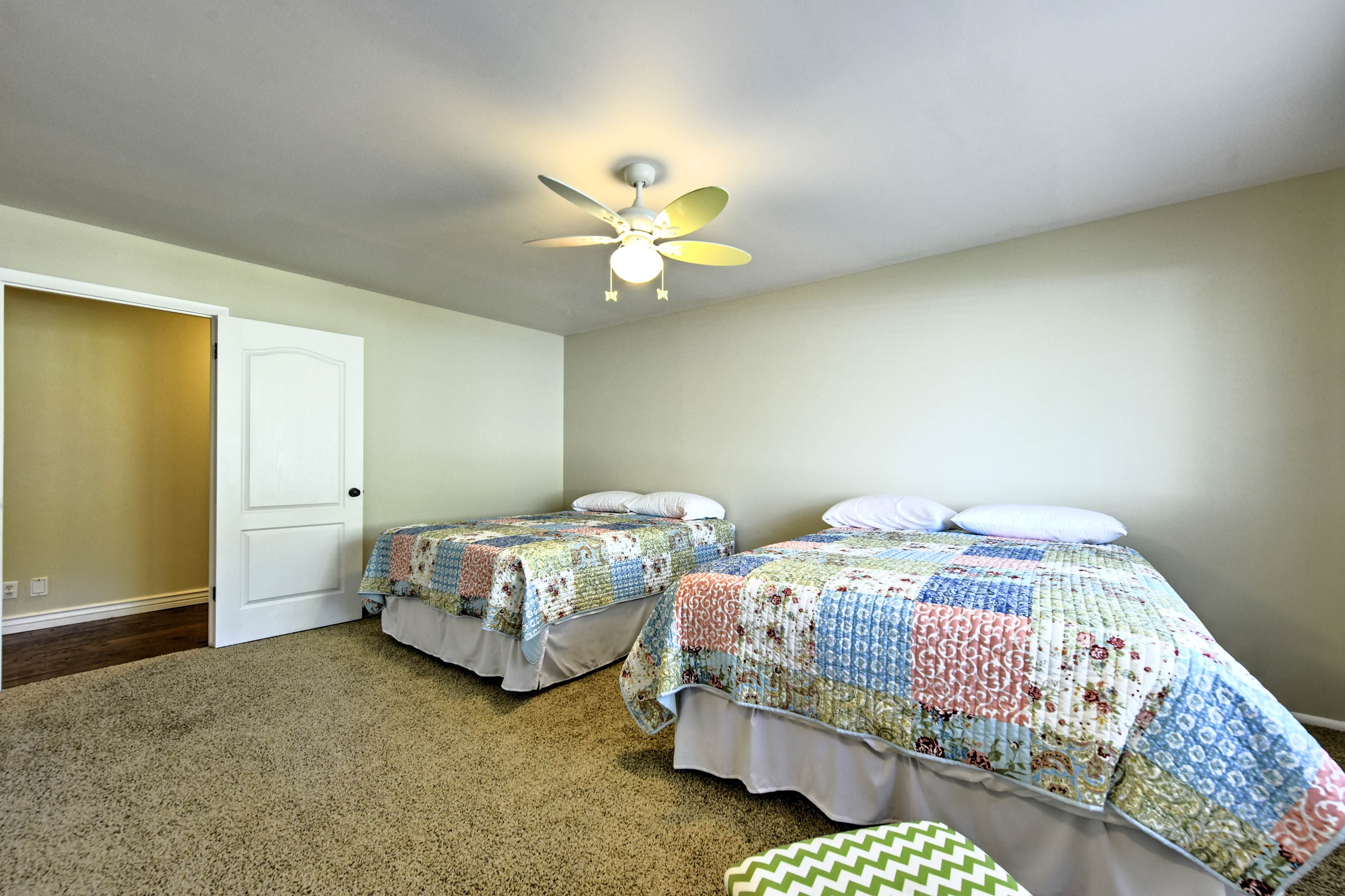 This second bedroom boasts 2 queen beds to sleep 4 travelers in comfort.