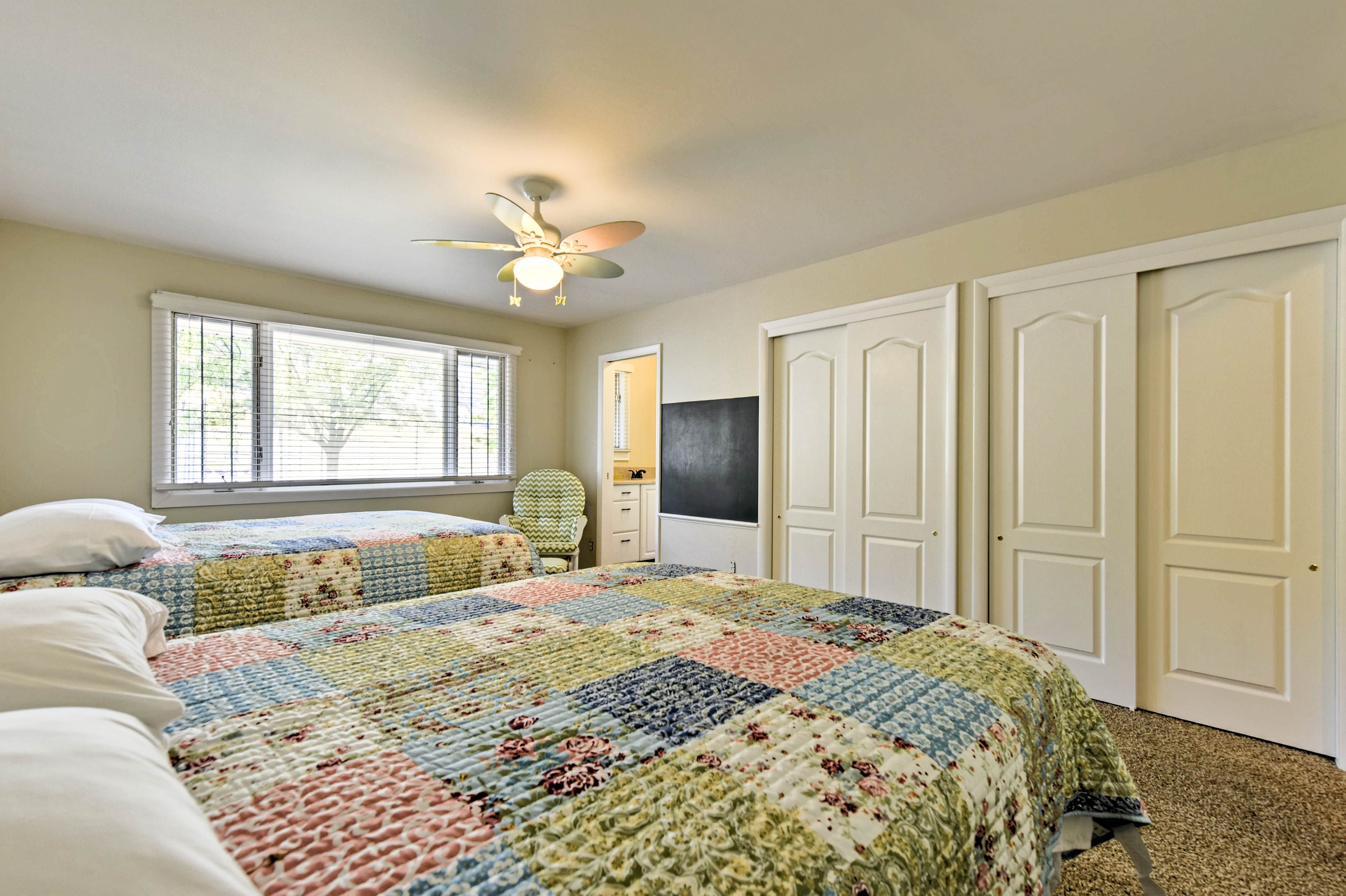 Two double closets and an en-suite half bathroom complete the bedroom.