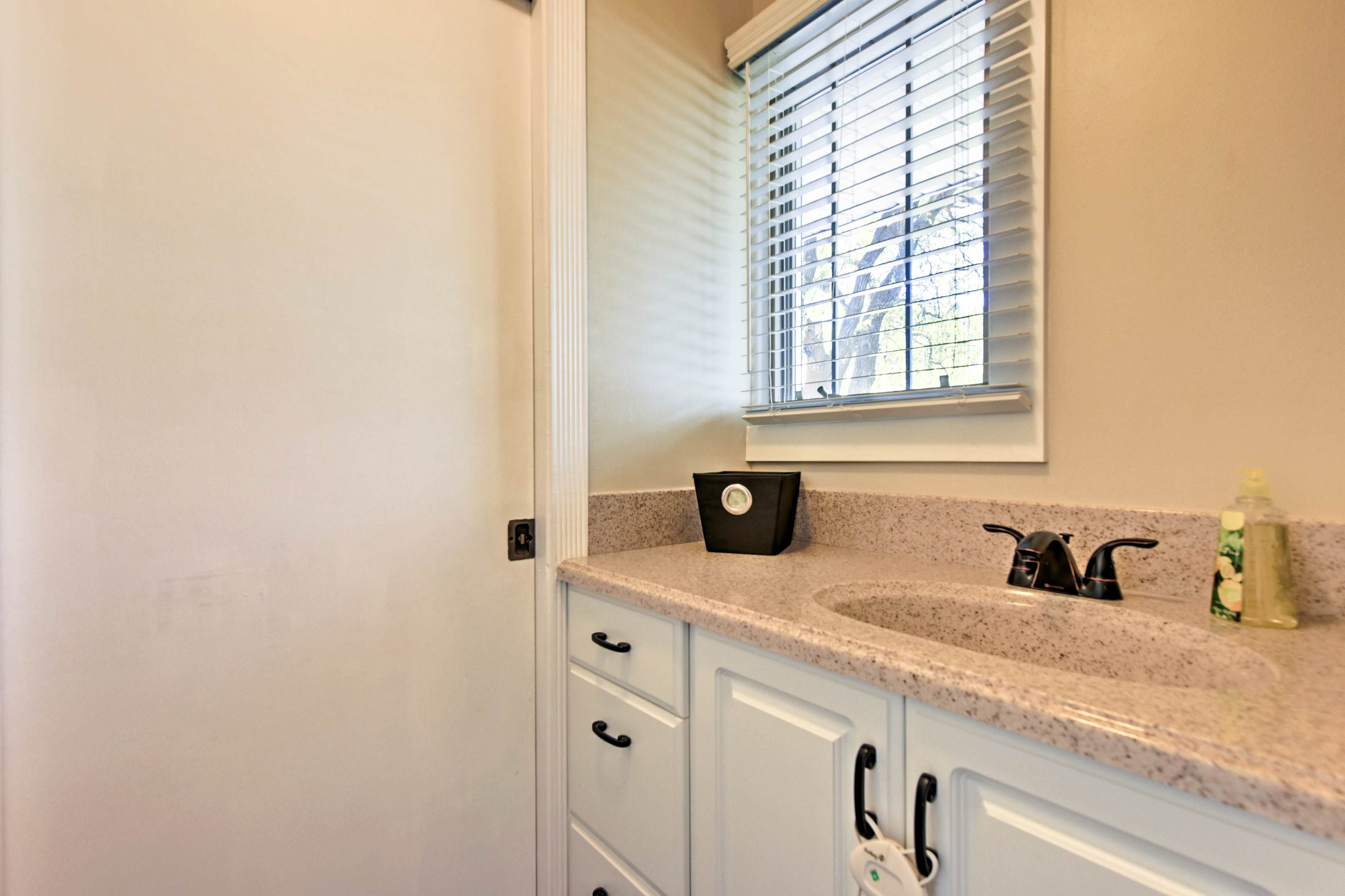 The conveniently located half bathroom is just steps away.