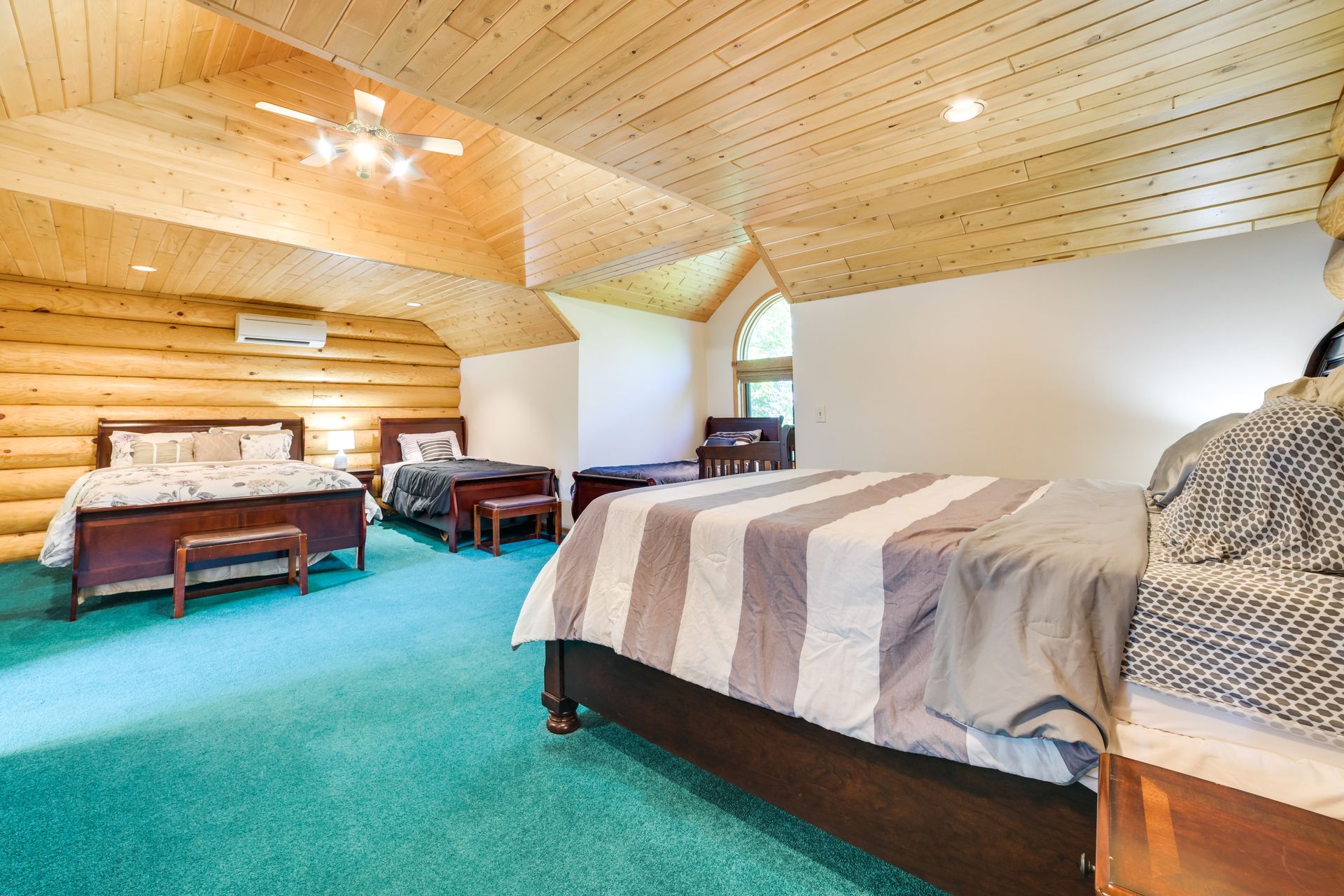 Bedroom 1 — upper level, 2 queen beds, 2 twin beds, crib