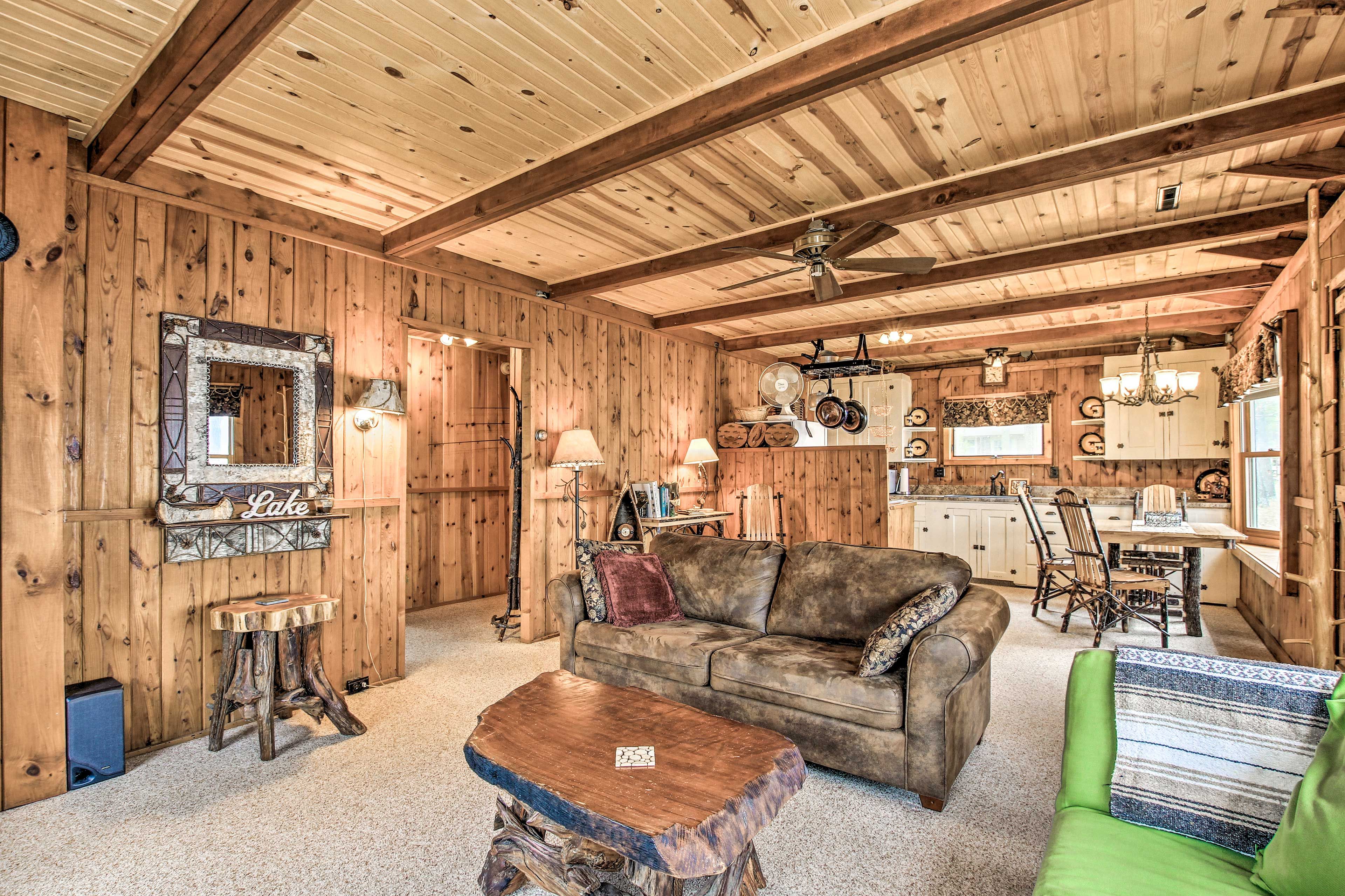 Have a seat on the couch to read a book after a long day on the lake.