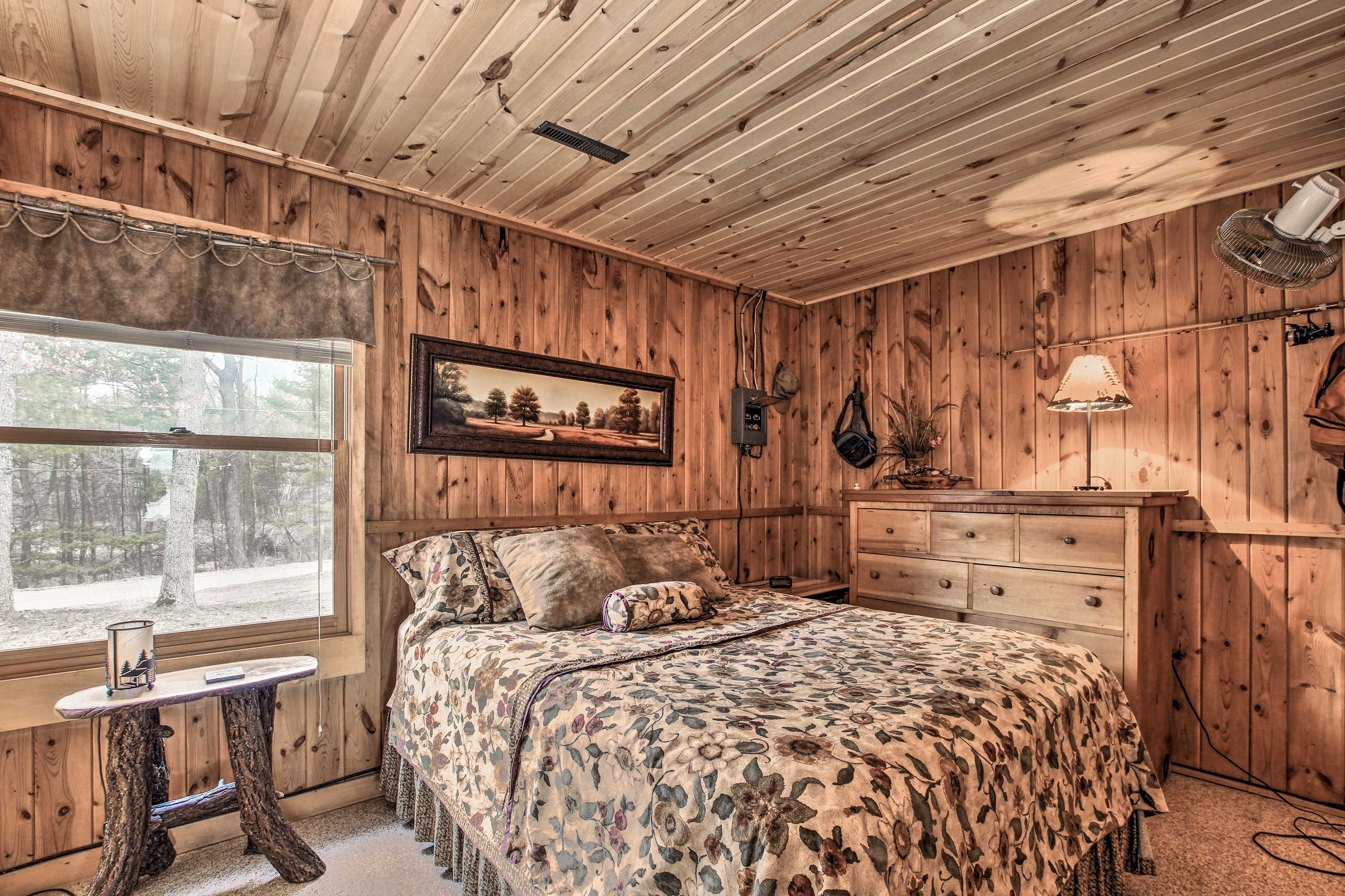 A queen bed highlights the second bedroom.