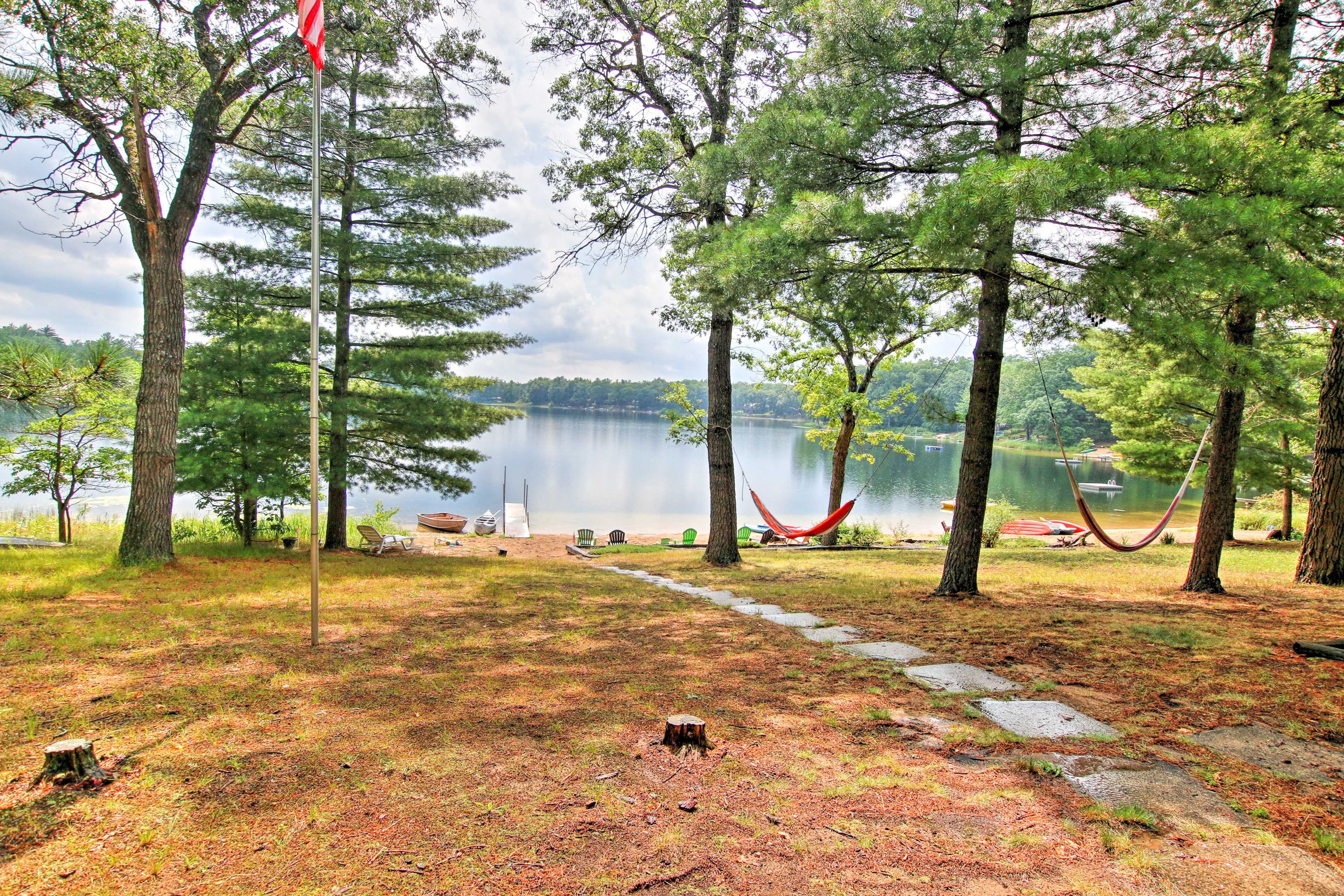 Lake-living awaits at this 2-bedroom, 1-bathroom Baldwin vacation rental cabin.