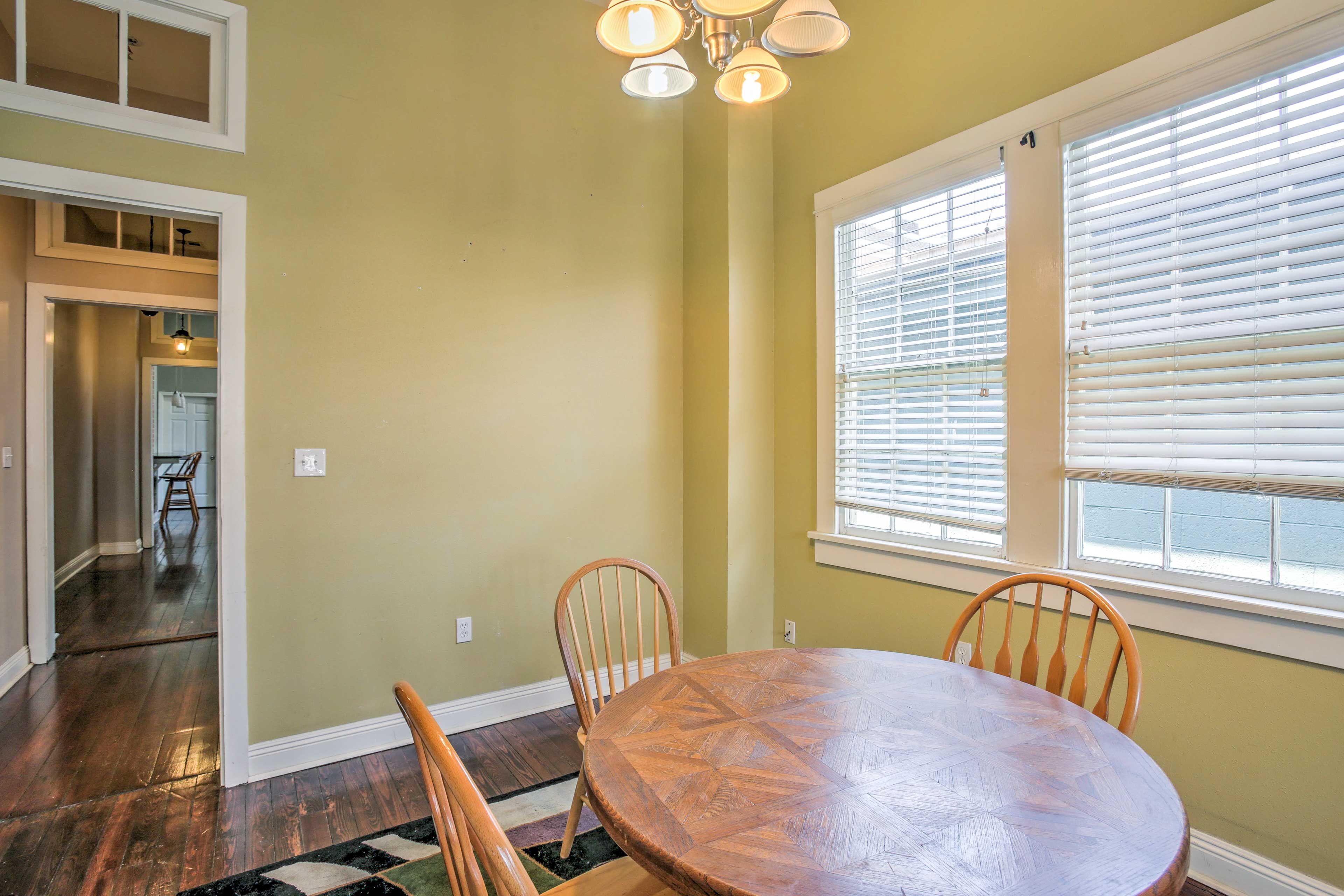 The dining table is perfect for a meal or playing a game of cards.