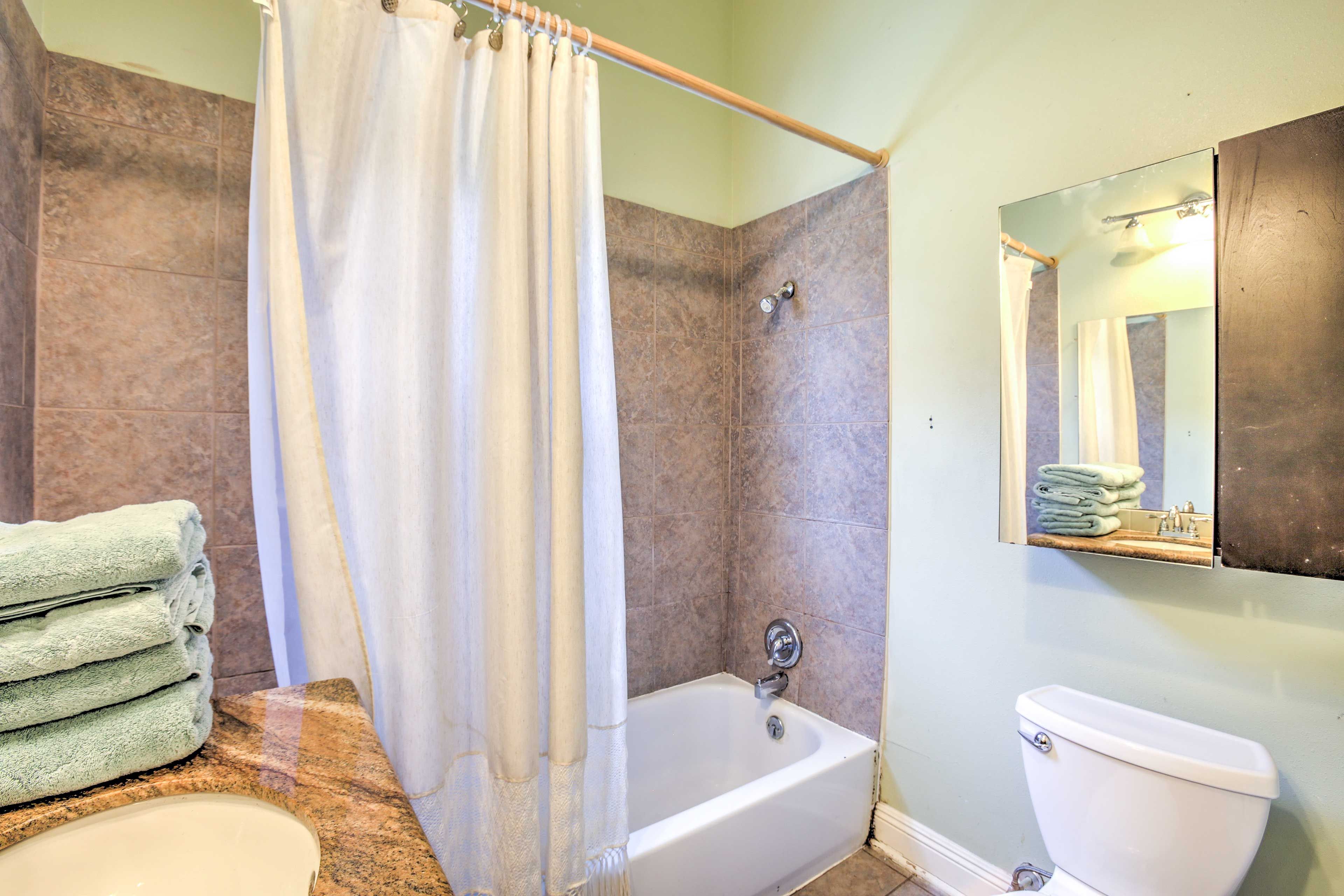 Soft towels, granite countertops and wood cabinets let you bathe in style.