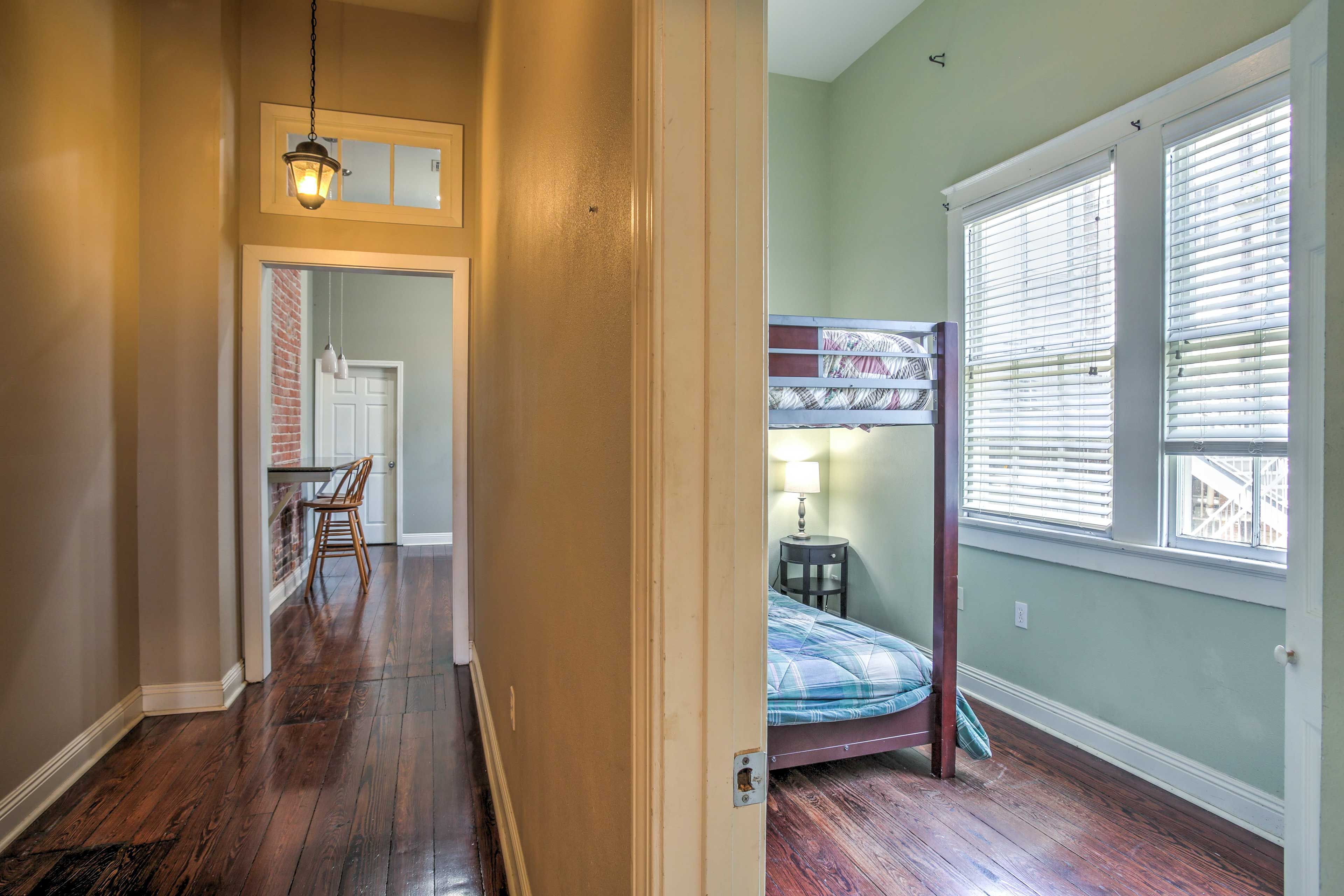 Steps down the hallway, 2 plush full beds promise blissful sleeping.