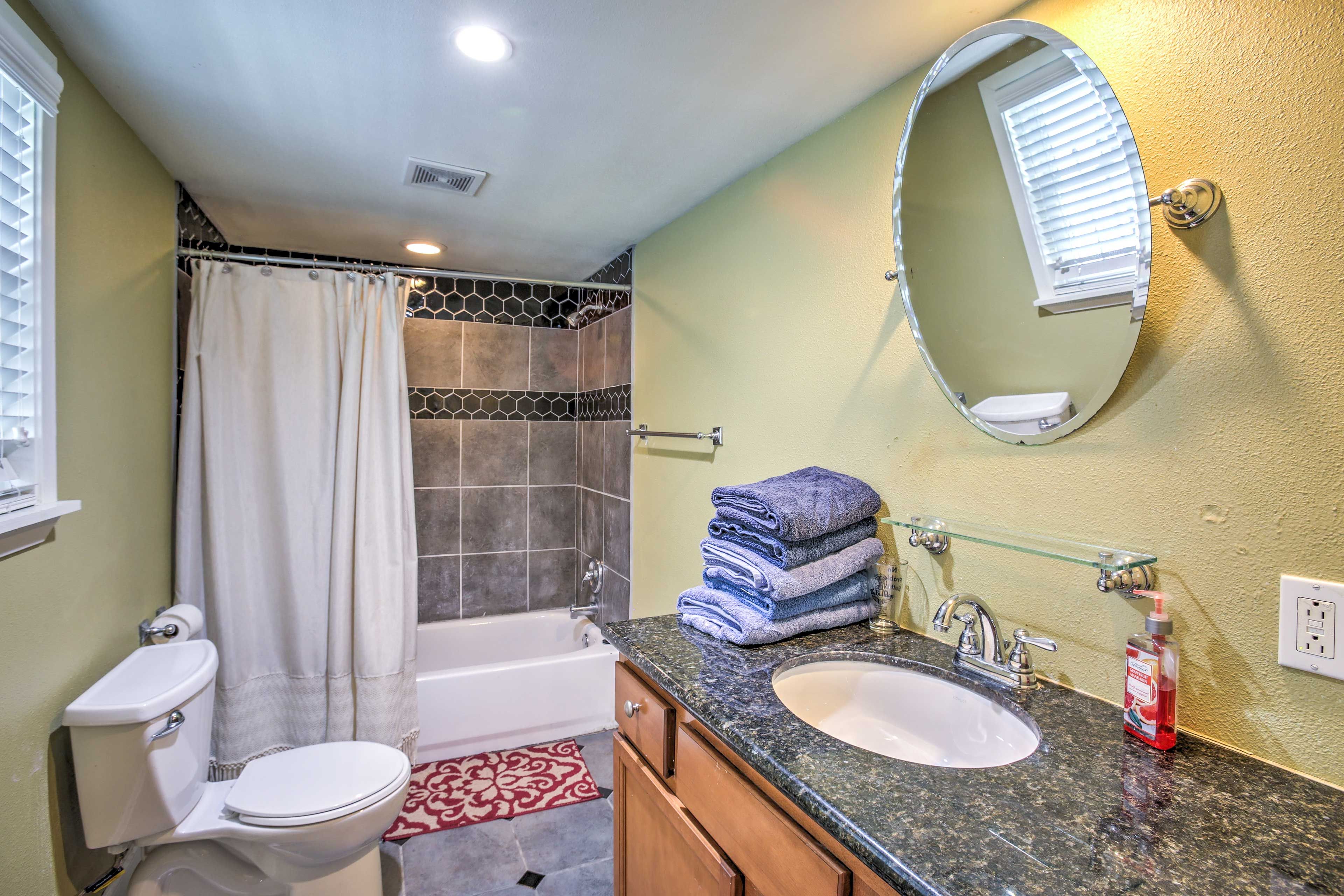 Honeycomb tiles detail the shower/tub combo to elevate your bathroom experience.