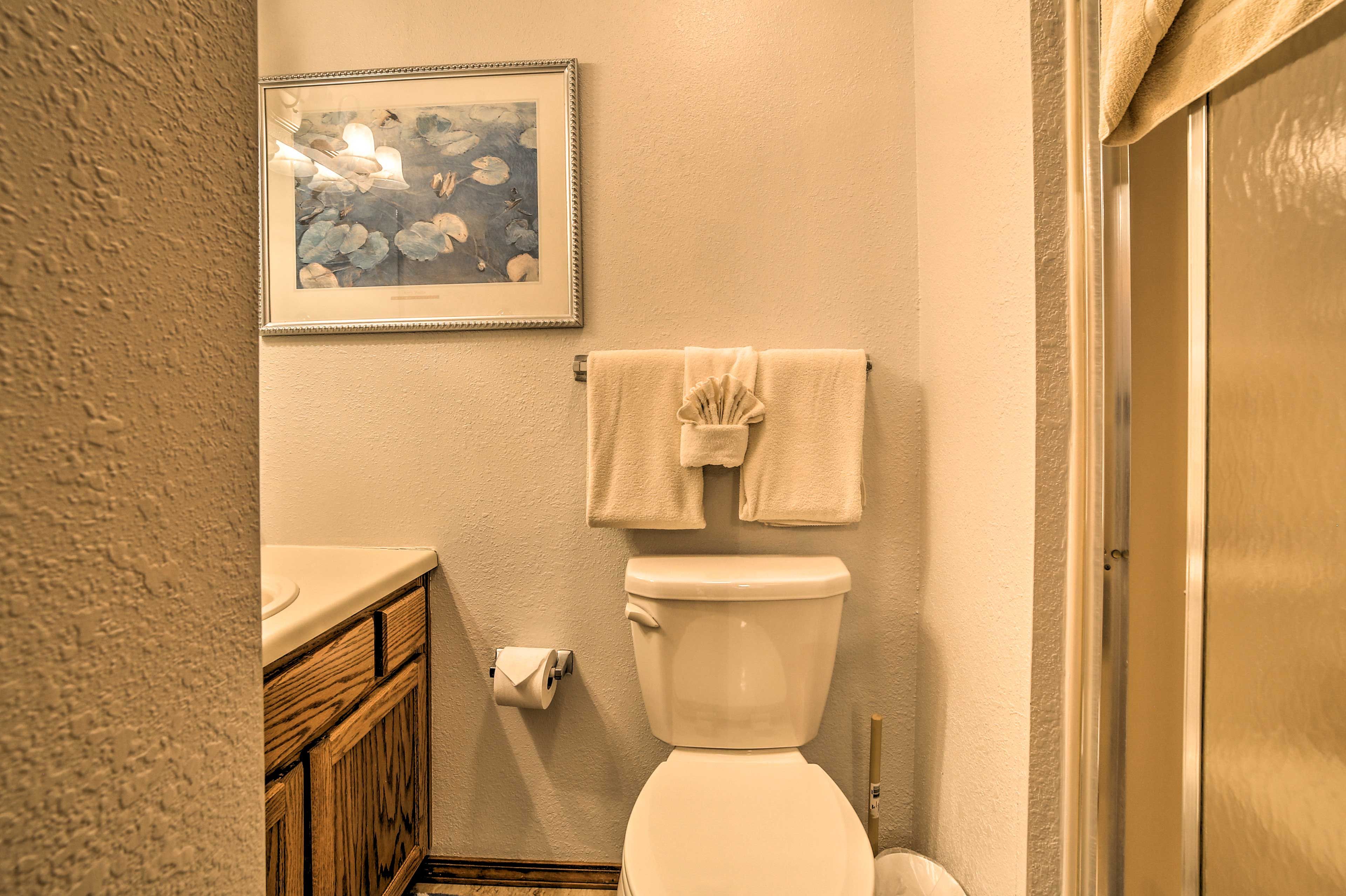Rinse off the day in this spacious bathroom.