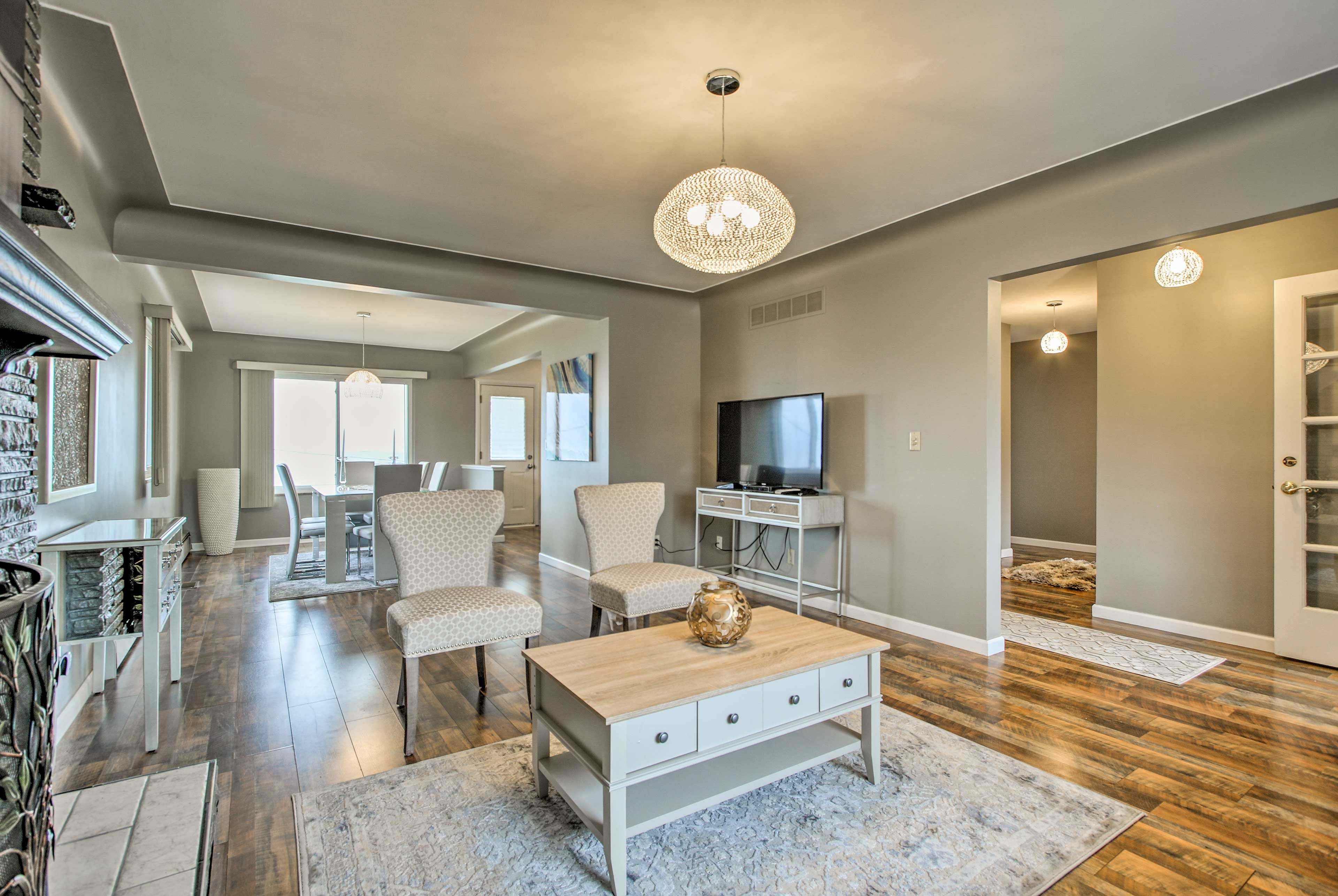 The floor-to-ceiling stone fireplace is a lovely focal point in the living room.