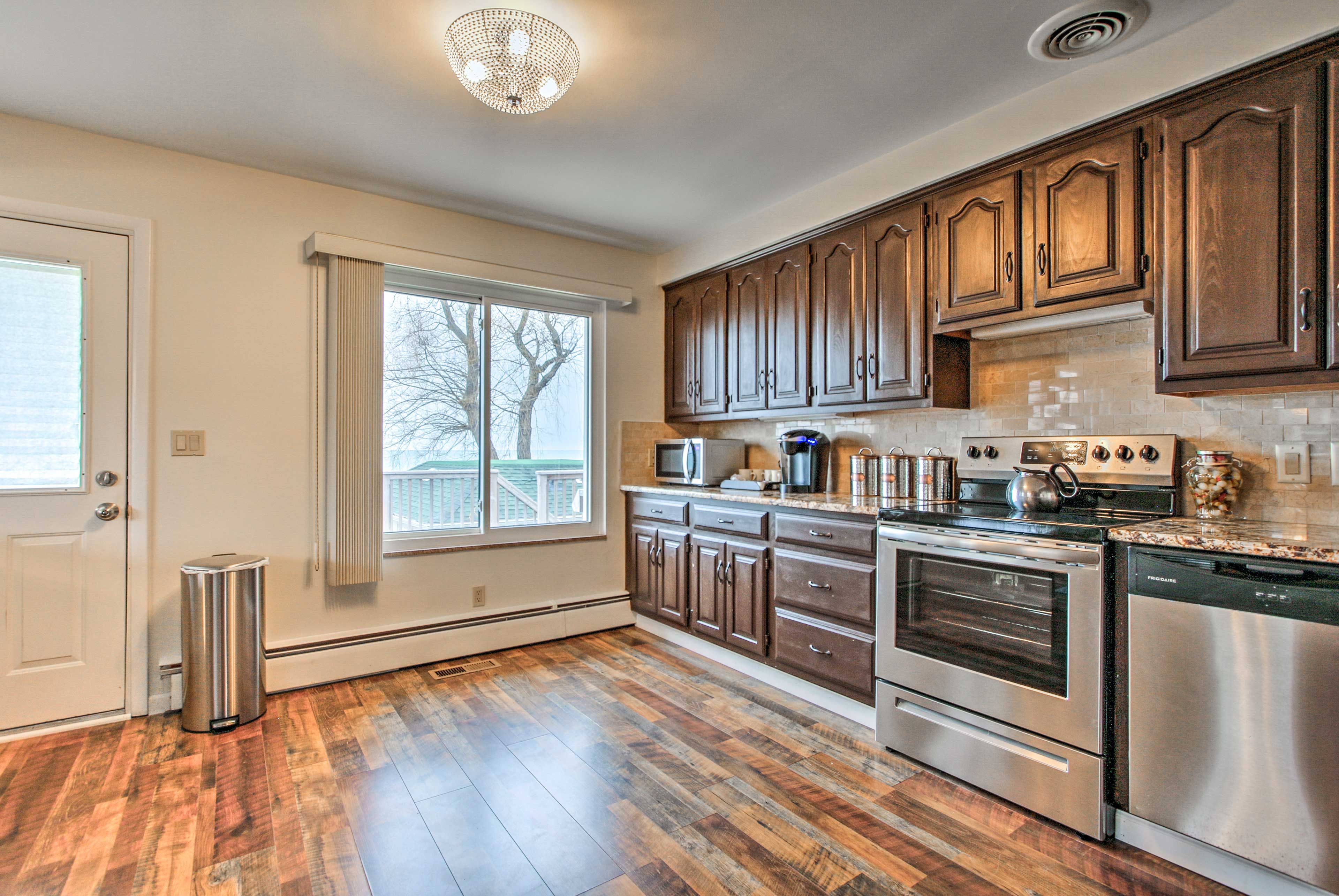Designed to impress, the kitchen features stainless steel appliances.