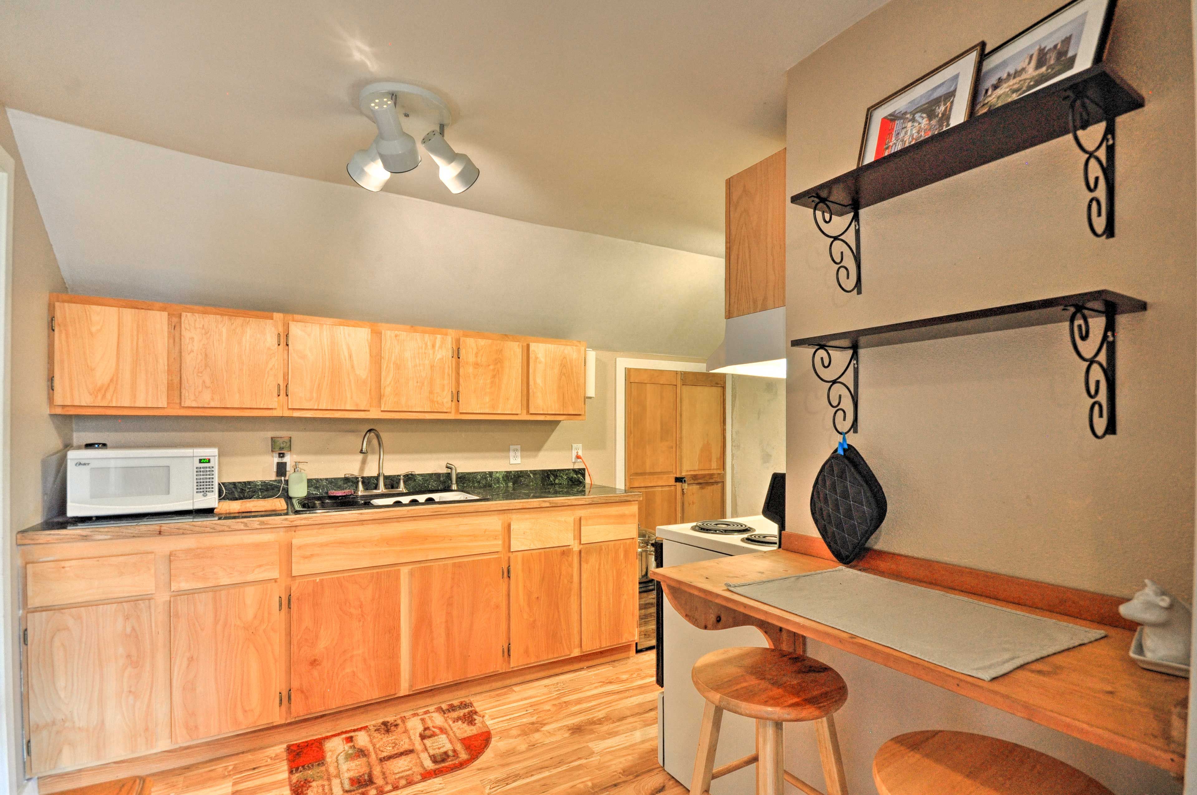 Through the hall, you'll find the well-equipped kitchen.