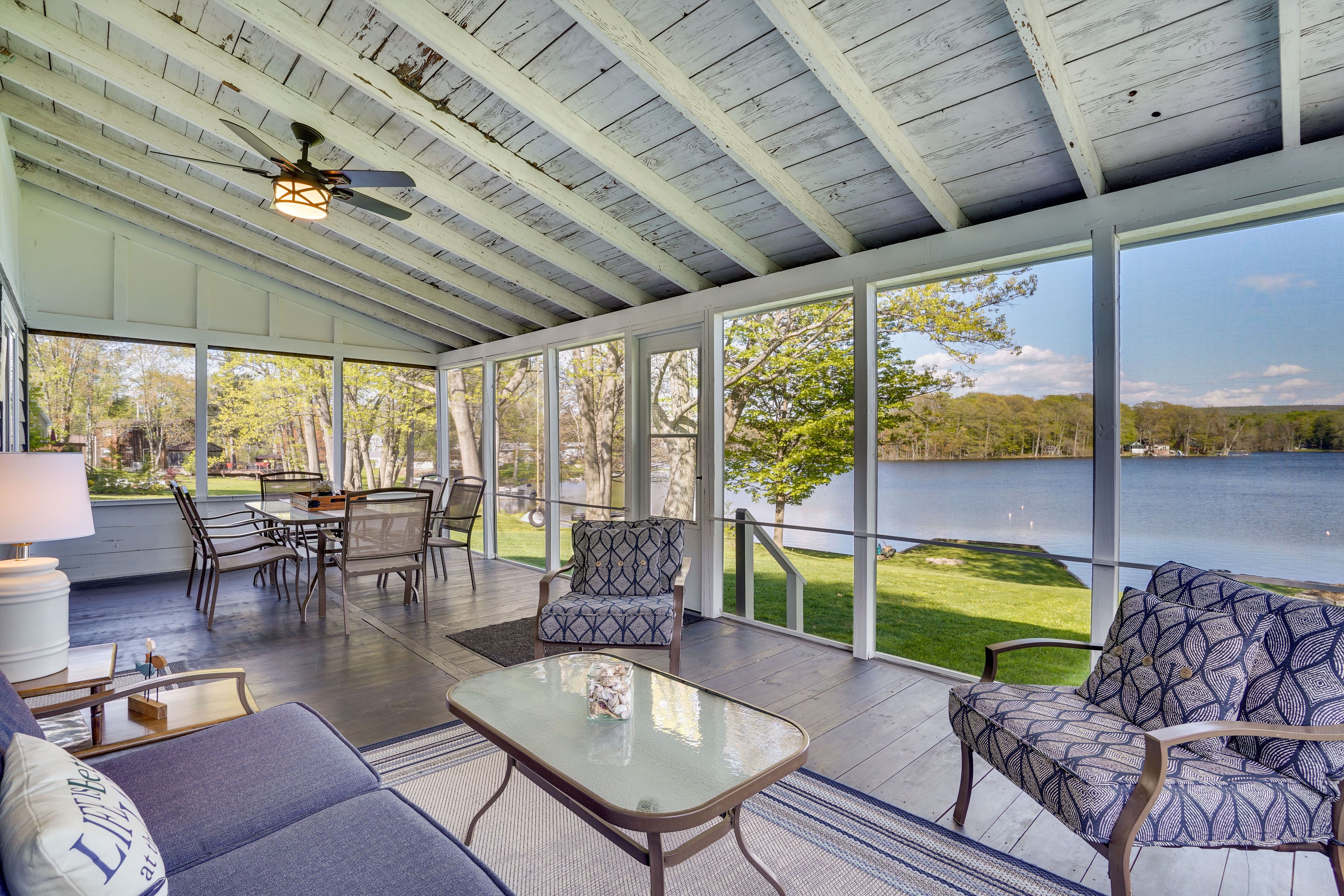 Enclosed Porch | Lake Views | Dining Area
