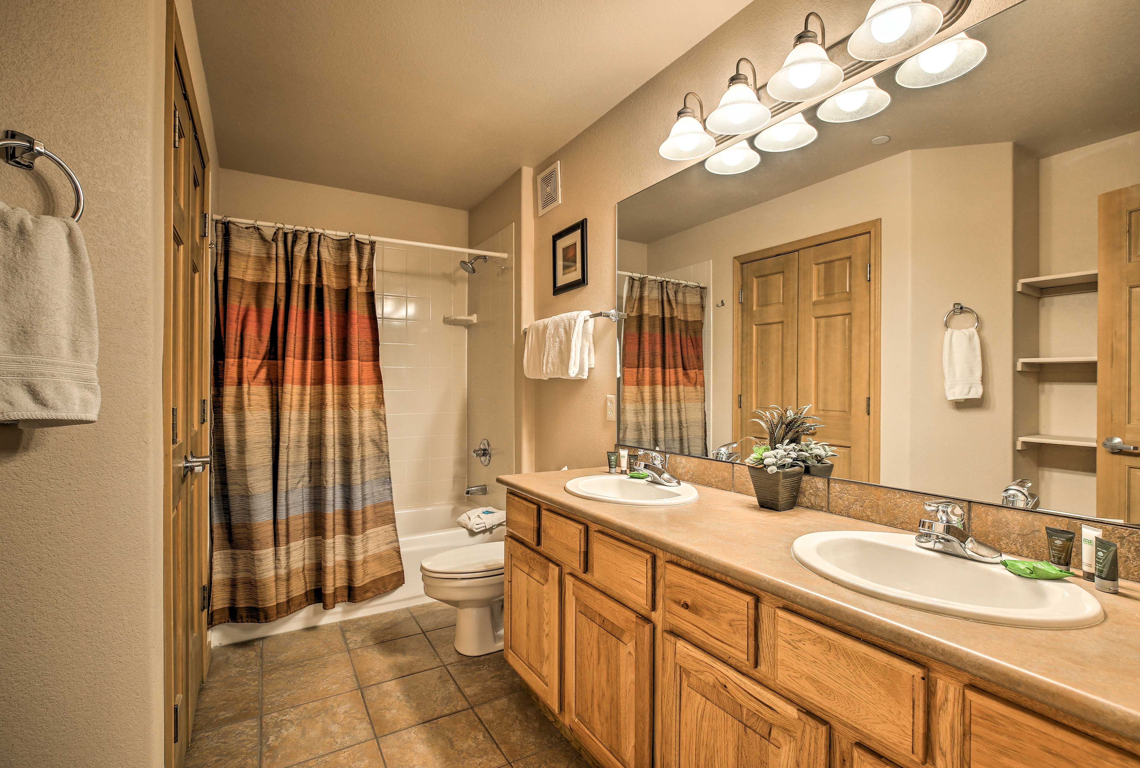 His-and-hers sinks highlight the master en-suite.