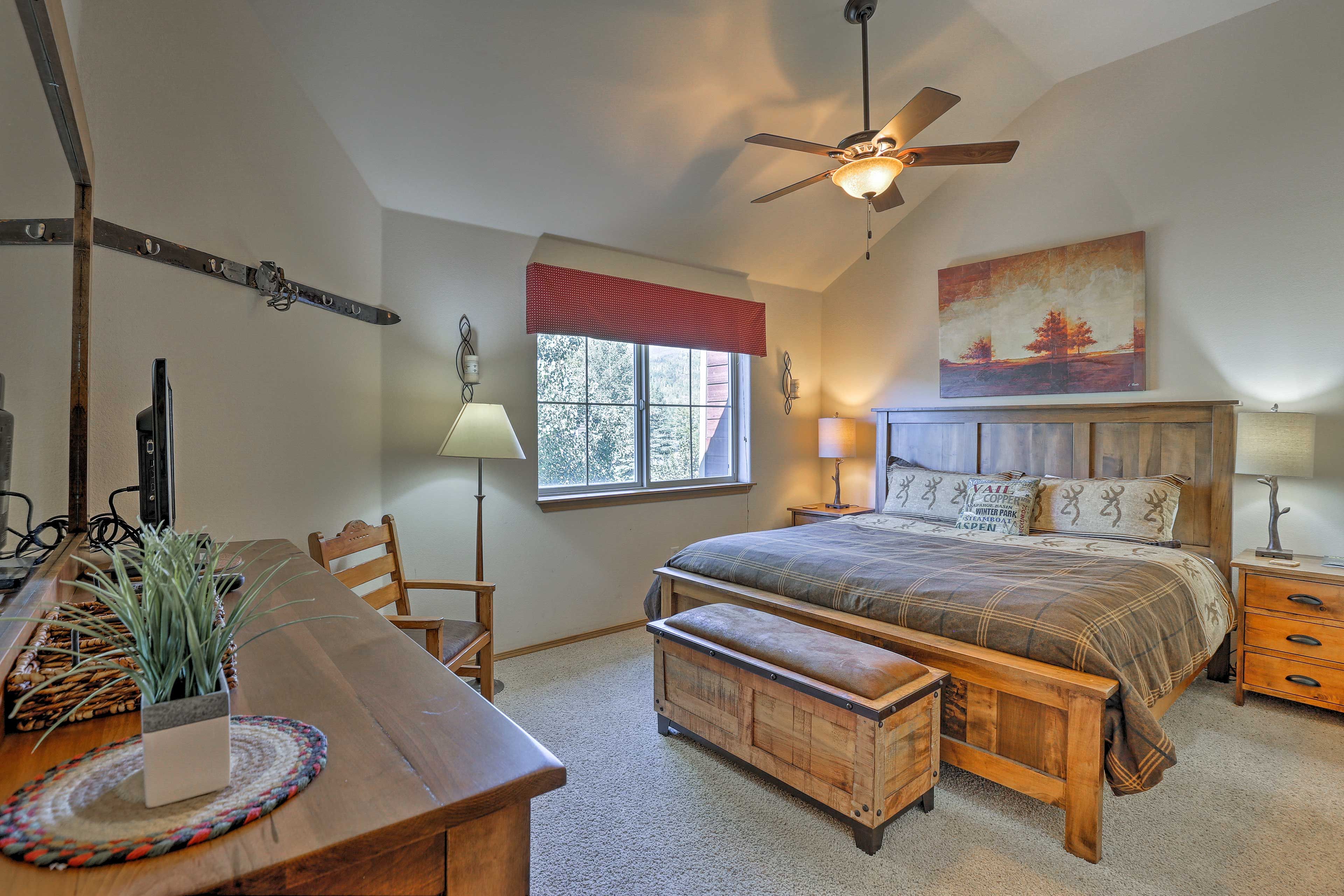 The master bedroom boasts private refuge with a plush queen bed.