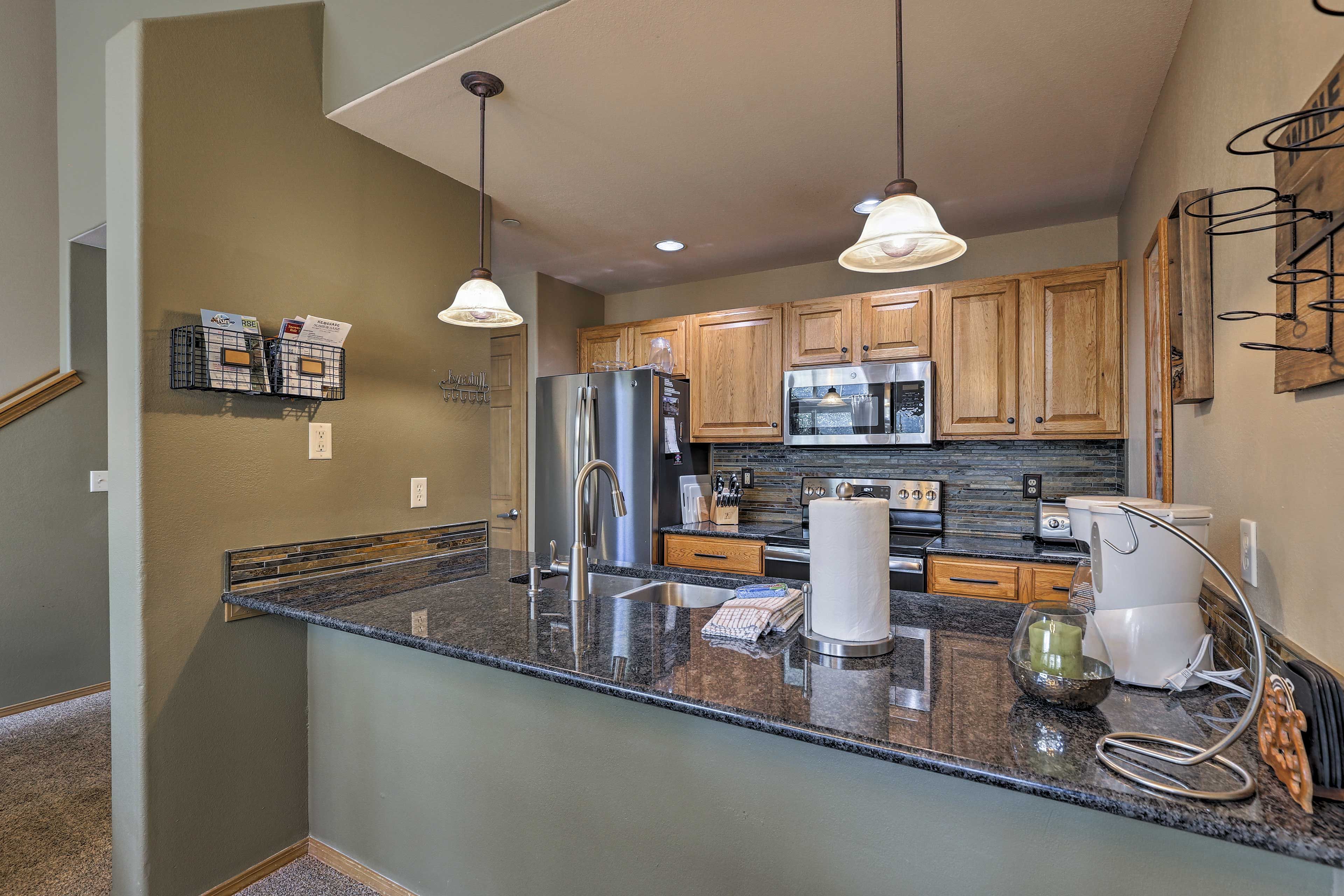 Sip wine at the bar while the chef cooks in the fully equipped kitchen.