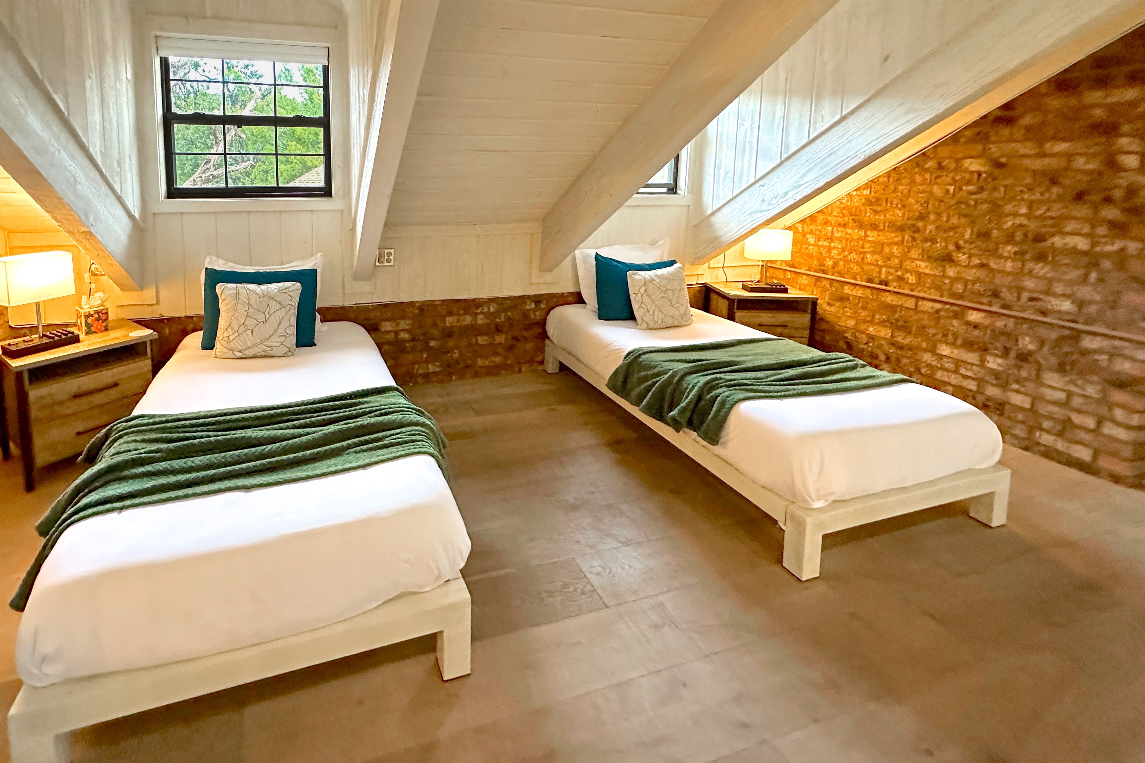 Upper Loft | 2 Twin Beds | Brick and Wood Beam Ceiling