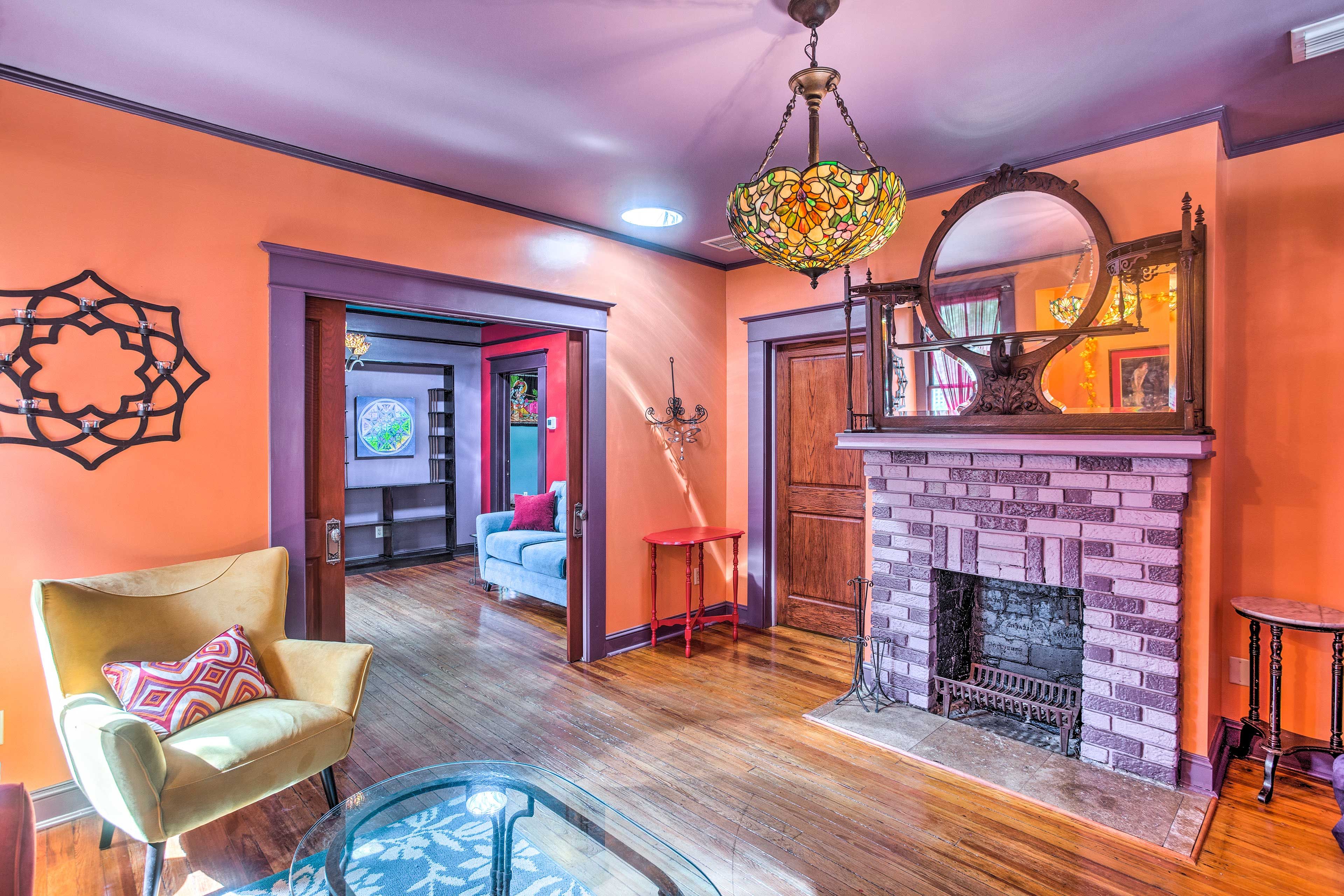 A stained glass light highlights the first living space.