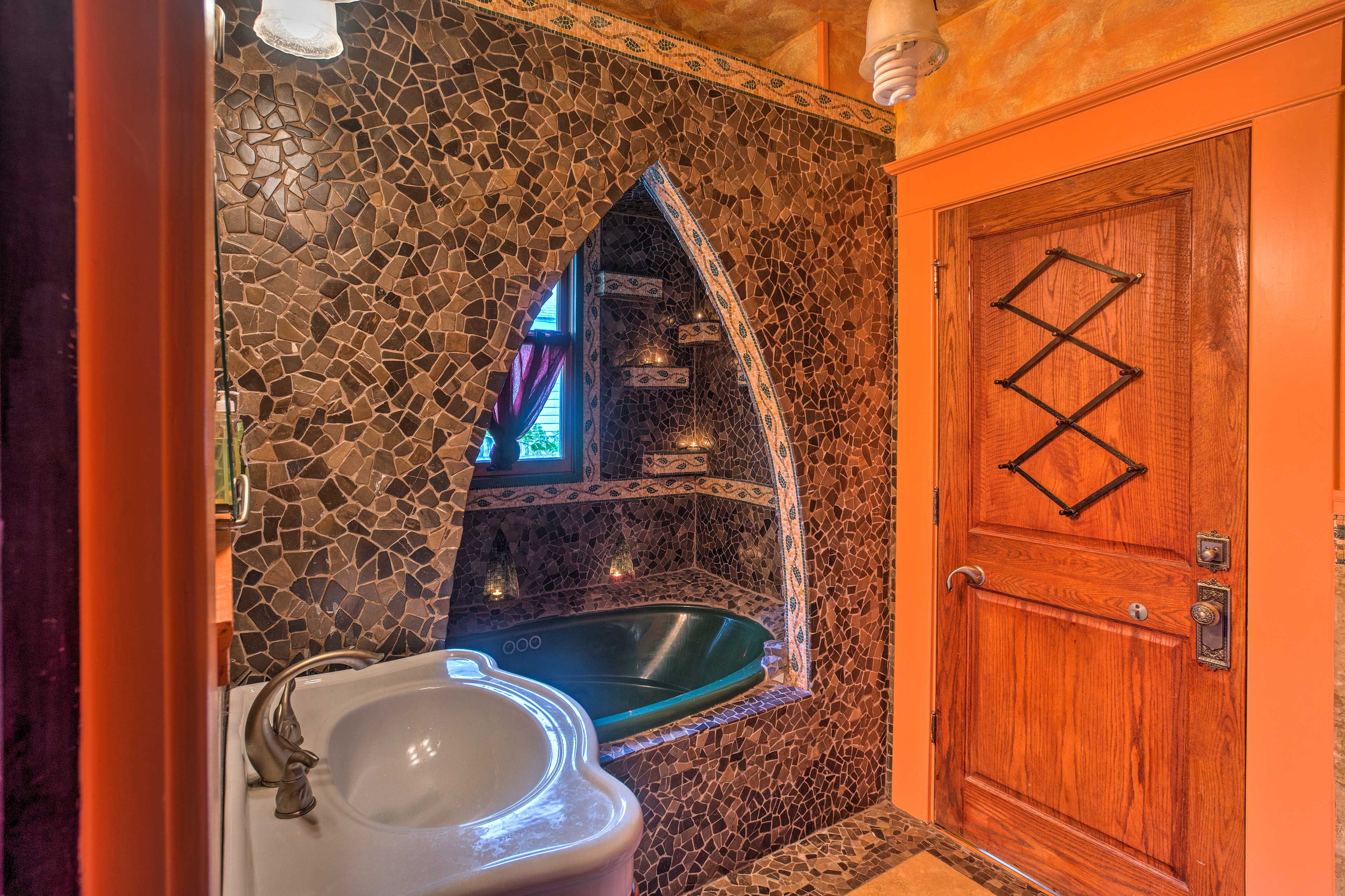 This one-of-a-kind bathroom hosts a beautiful tiled shower.