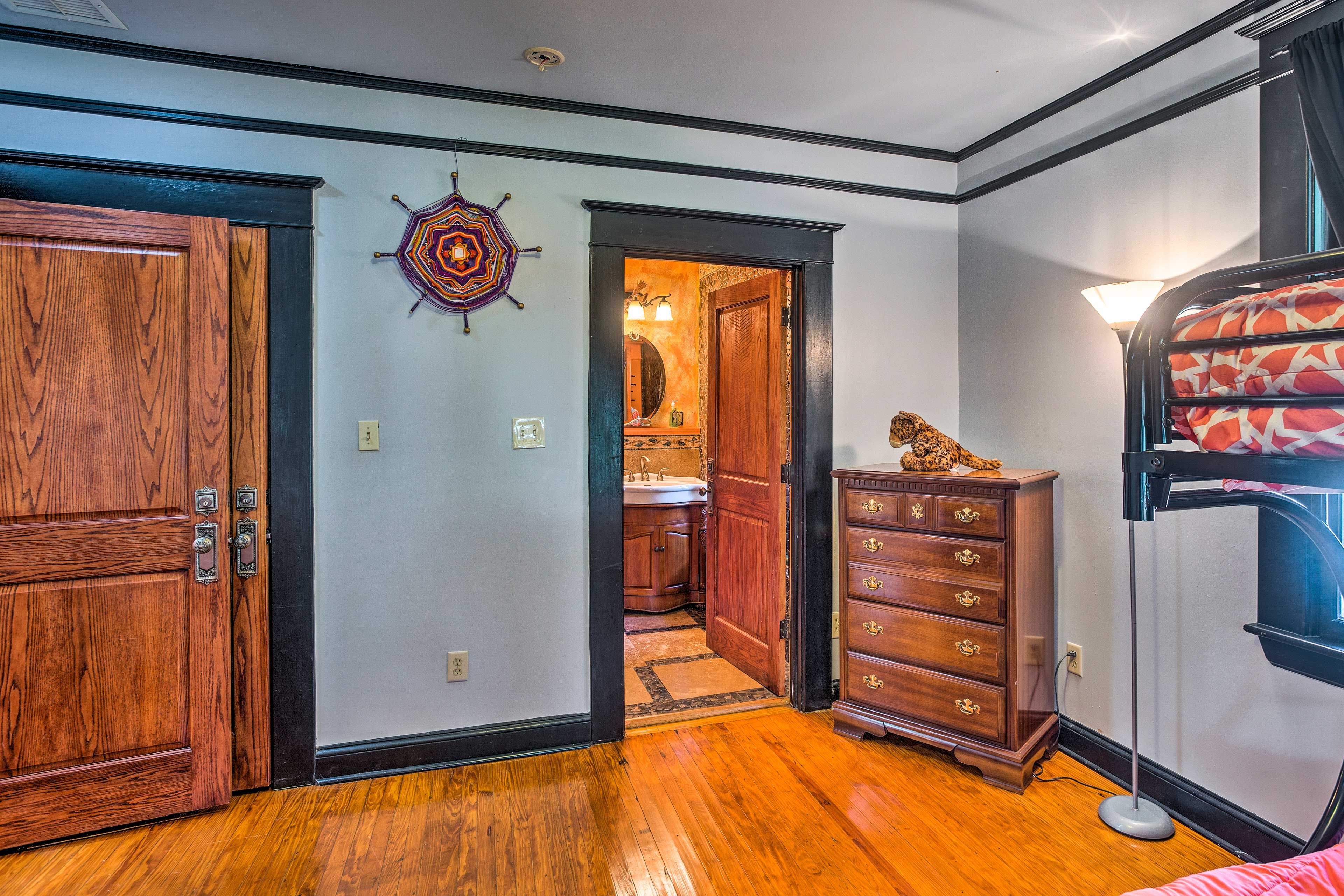 Each bedroom provides access to the bathroom.