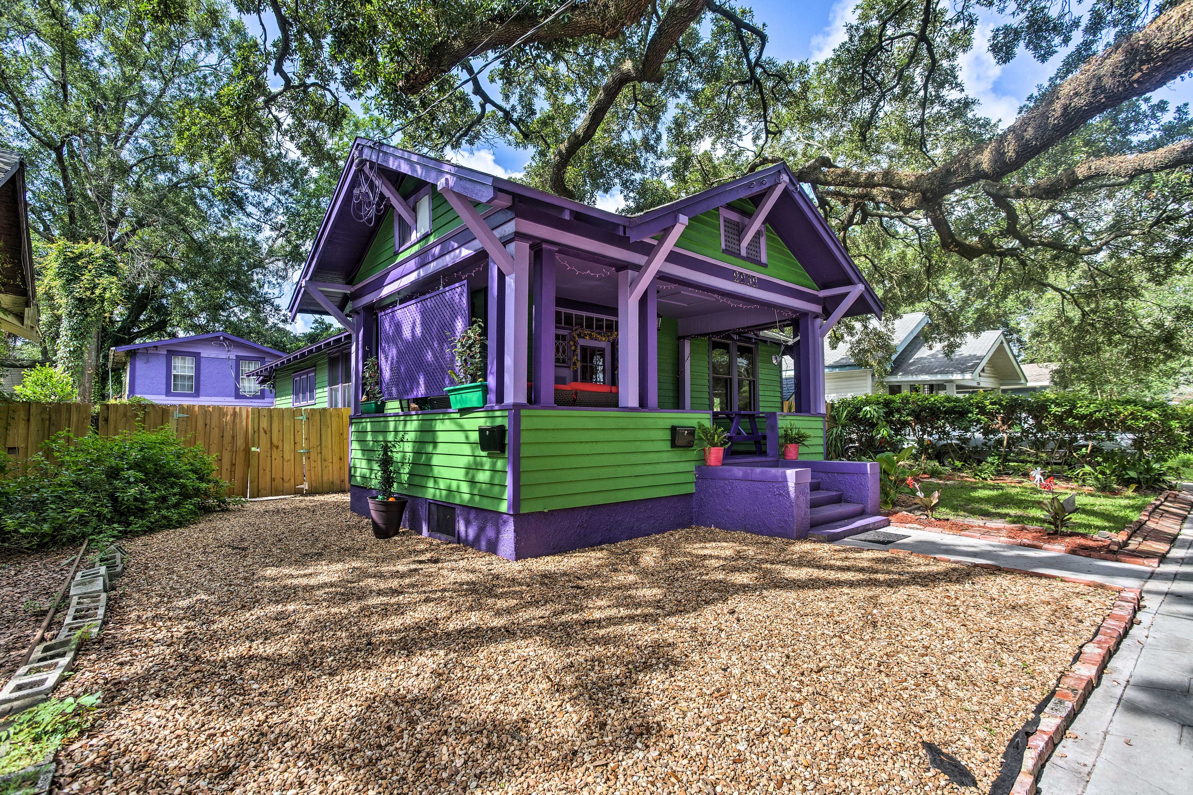 A bright green and purple exterior makes this home pop!