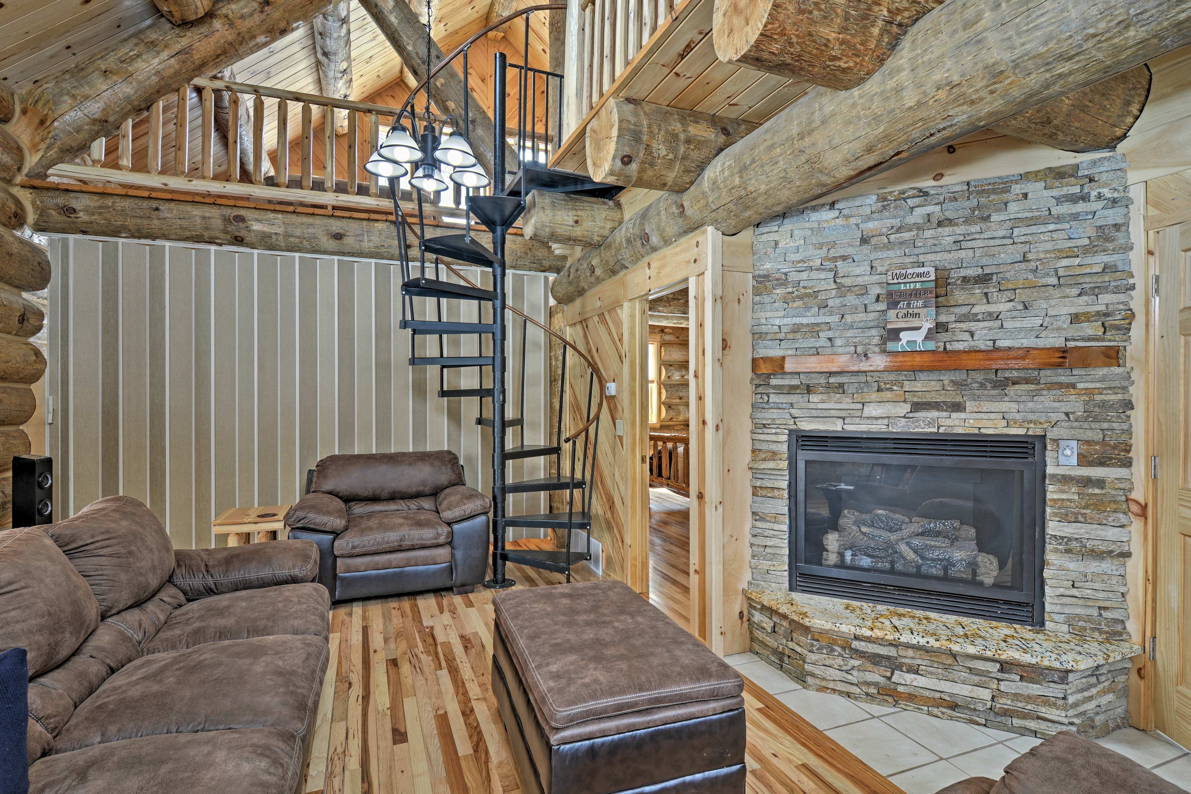 A gorgeous stone gas fireplace highlights the living room.