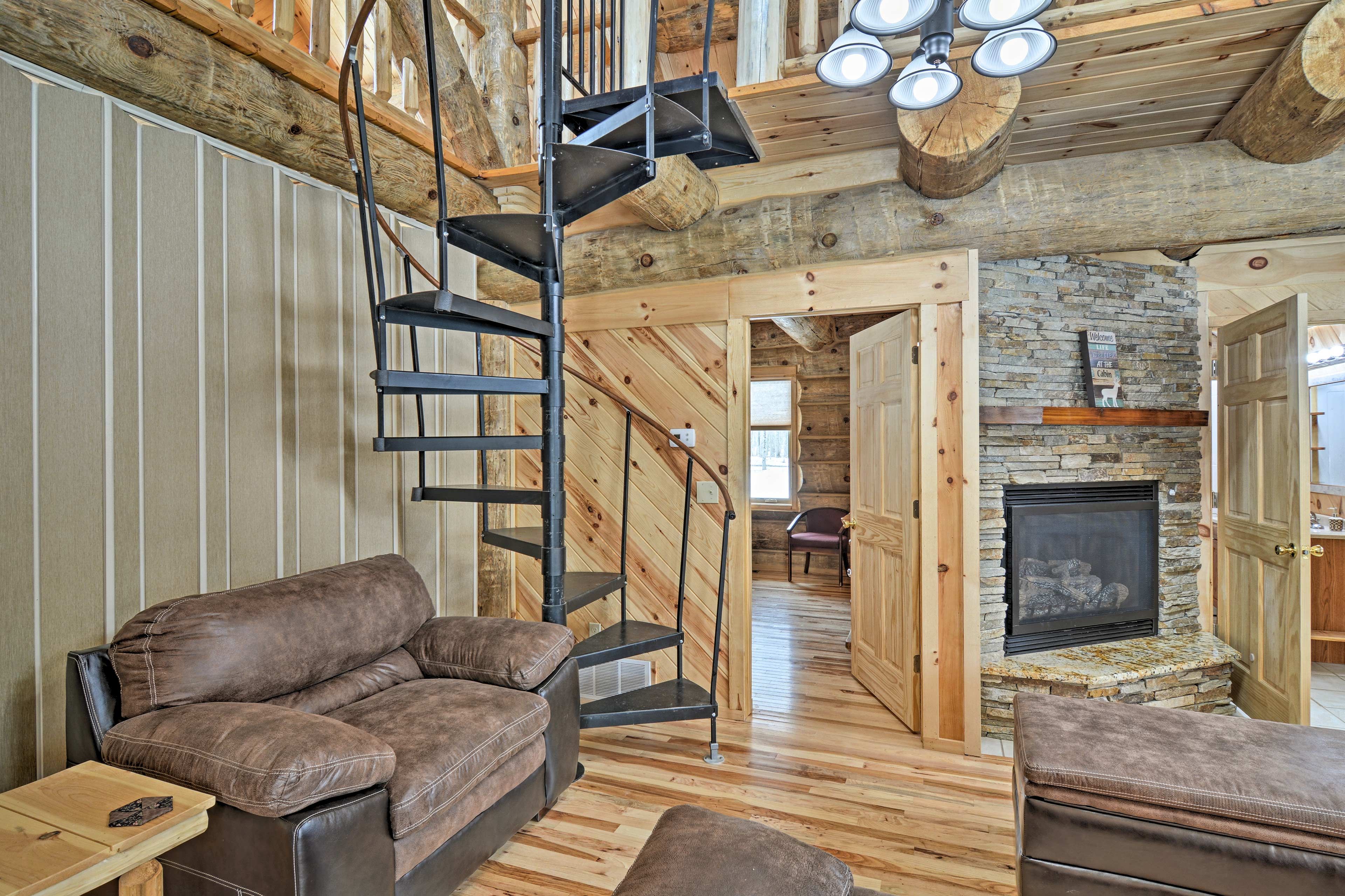 Hardwood floors and log walls exude rustic charm.
