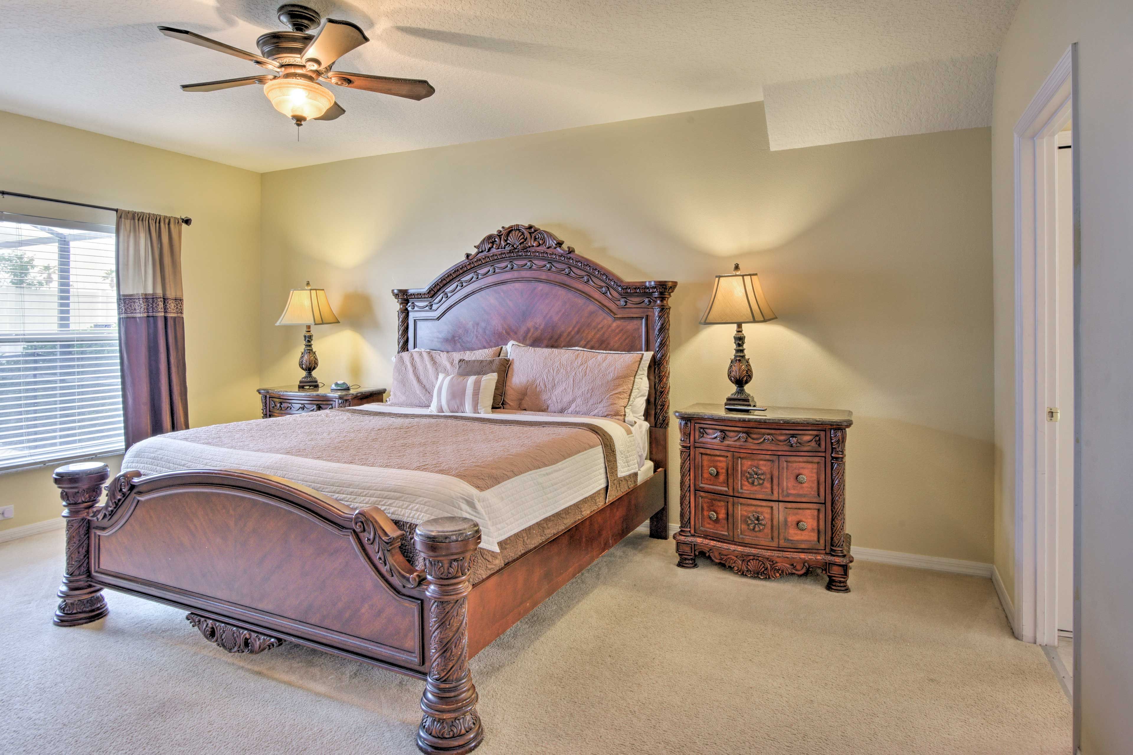 The bedroom boasts a plush king bed.
