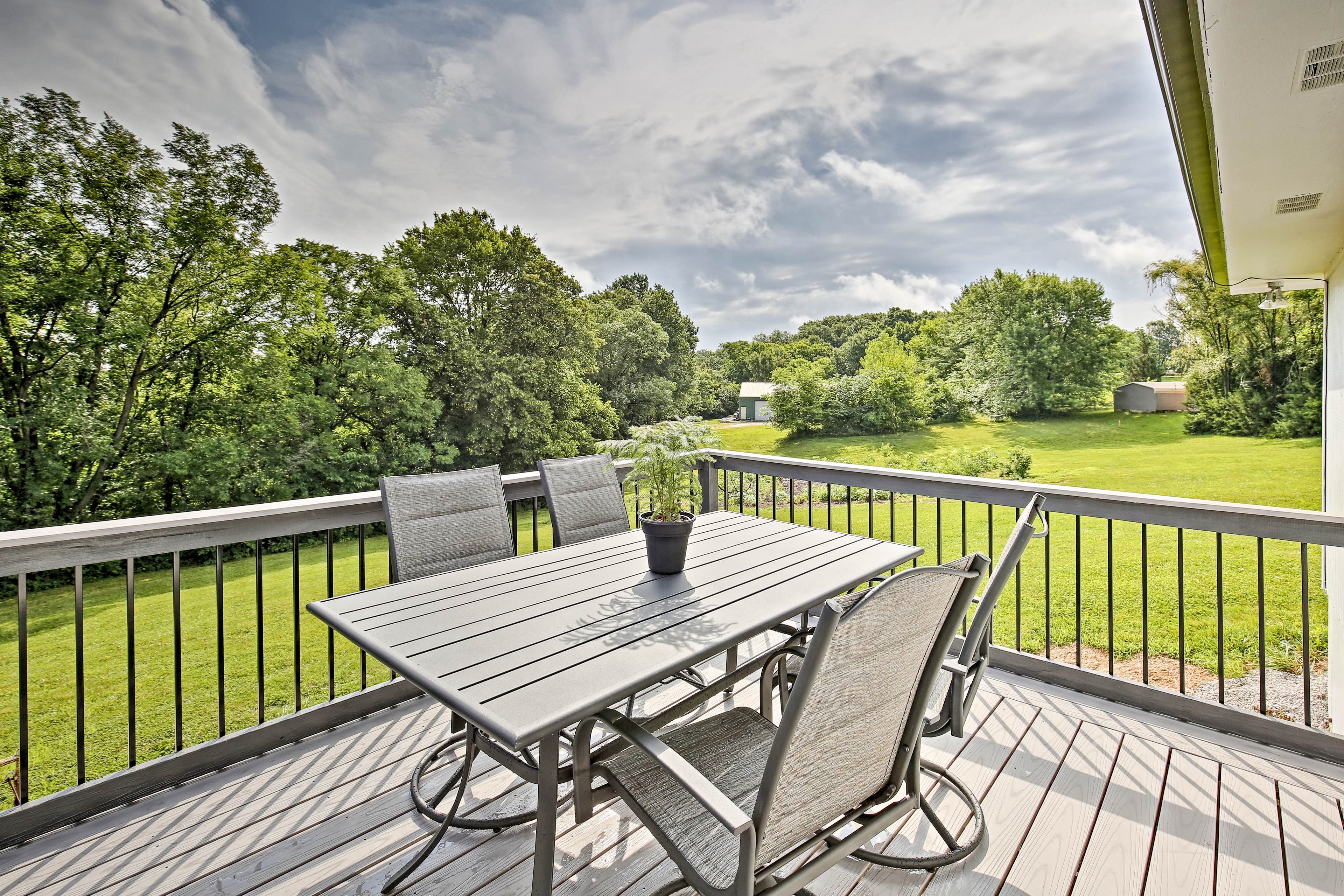 Soak up the sun from the back deck with outdoor dining.