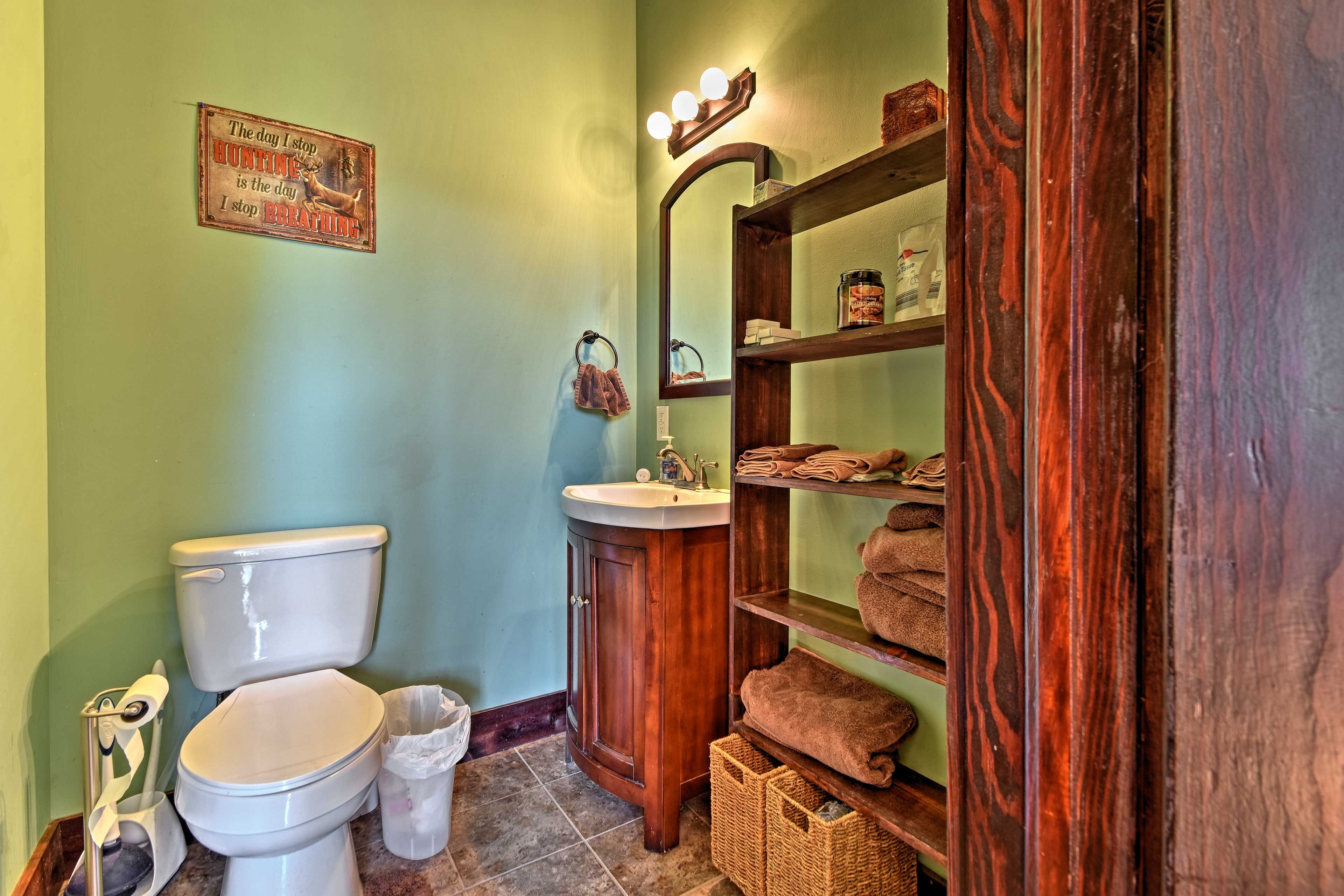 Get ready for the day in the full bathroom.